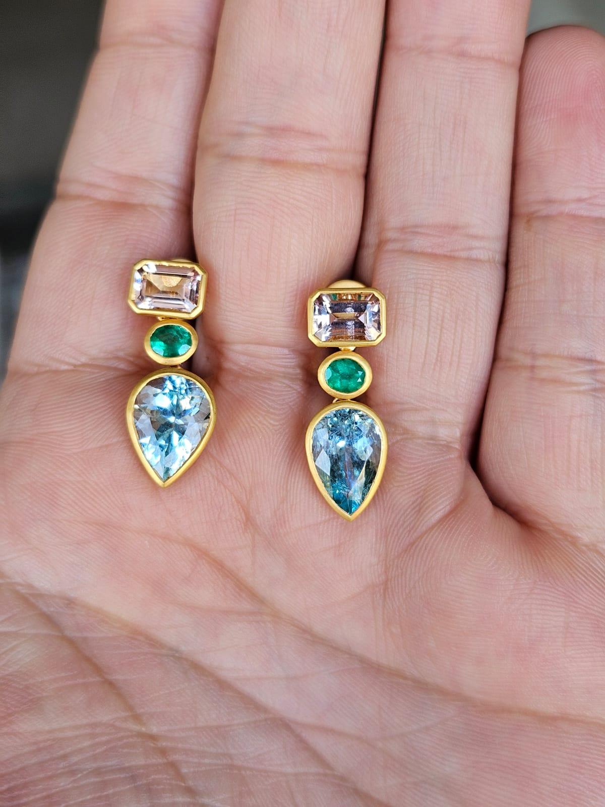 A very gorgeous and beautiful, Aquamarine, Emerald & Morganite Dangle Earrings set in 18K Yellow Matte Gold. The weight of the Morganites is 1.73 carats. The weight of the Emeralds is 0.54 carats. The Emeralds are completely natural, without any