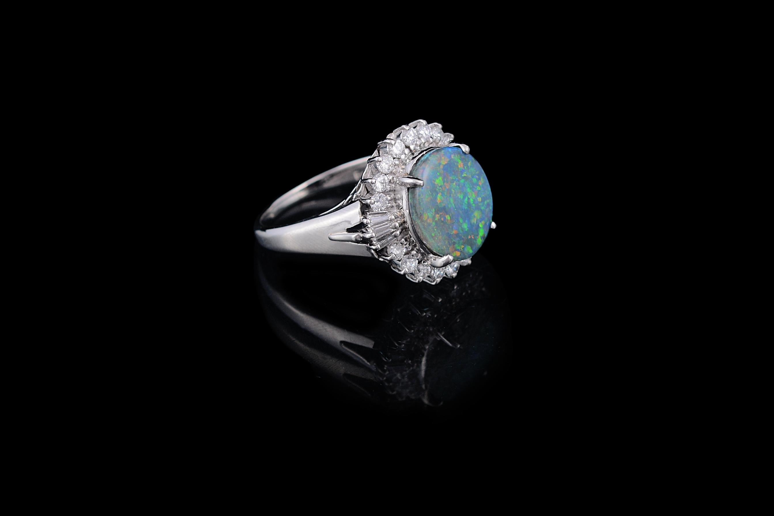 For those who want something different, a very gorgeous Australian Opal cocktail/engagement ring with diamonds. The Australian opal weighing 3.15 carats and has a gorgeous play of green and blue on its surface. The weight of the diamonds is 0.9