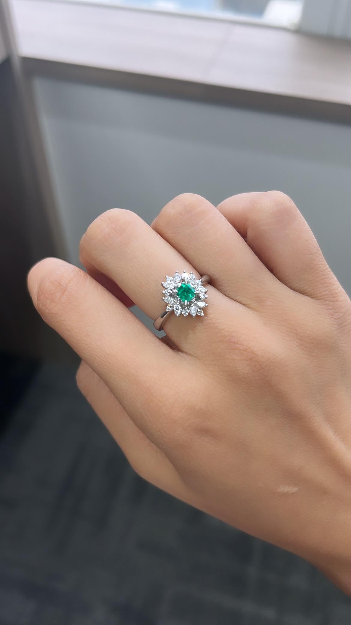 A very gorgeous and one of a kind, Emerald Engagement Ring set in Platinum 900 & Diamonds. The weight of the Emerald is 0.39 carats. The Emerald is of Columbian origin, and is completely natural, without any treatments. The weight of the Diamonds