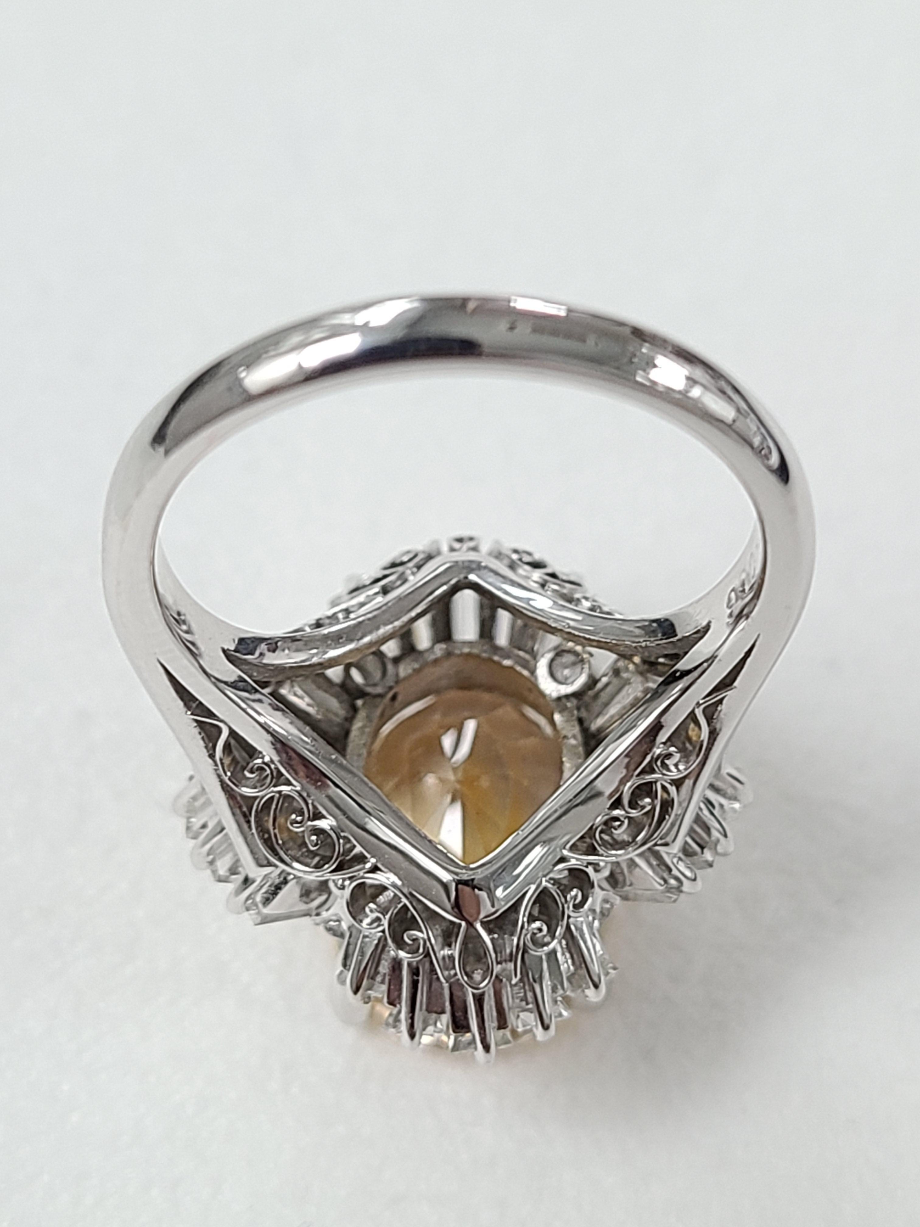 Women's Platinum PT900 Orange Sapphire Ring with Diamonds