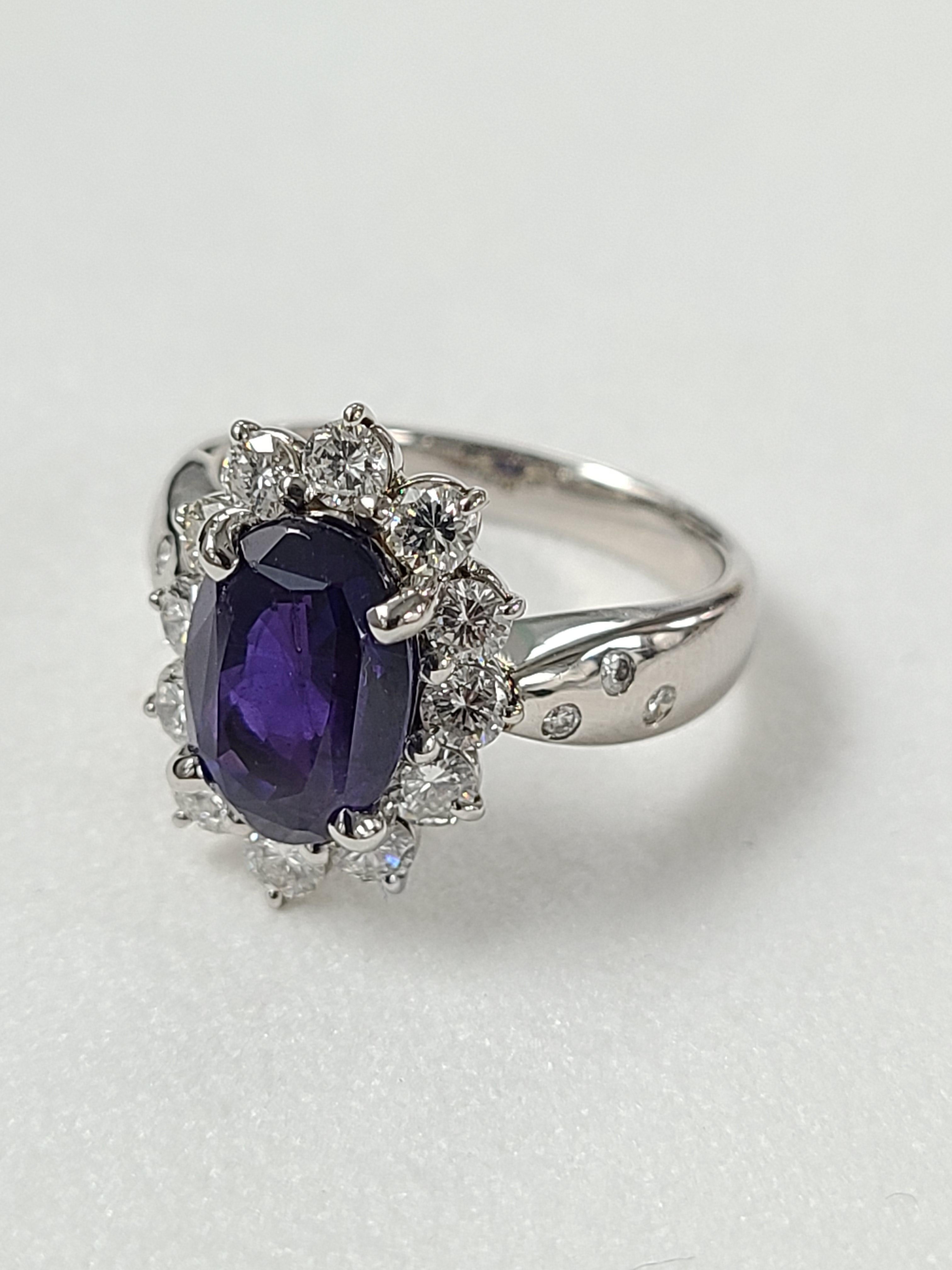 A gorgeous Purple sapphire ring set in platinum PT900 with diamonds . The purple sapphire is heated and weight of the stone is 3.715 carats and diamond weight is 1.00 carat. Purple sapphires and not very common and this is a great price for such a