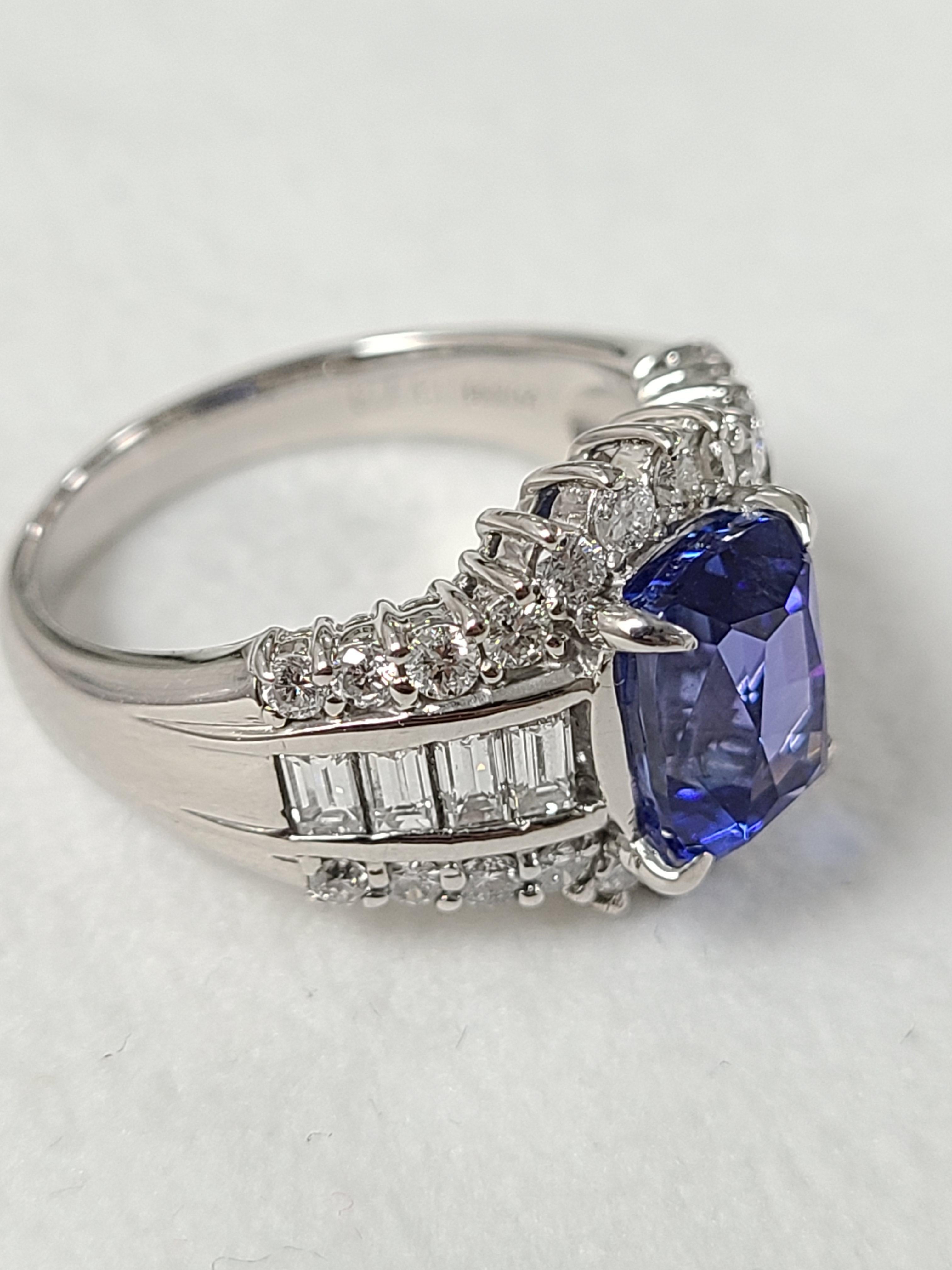 A gorgeous Tanzanite ring set in platinum PT900 with diamonds. Tanzanite weight is 3.79 carats , Diamond weight is 1.36 carats . Ring dimensions in cm 1 x 2 x 2.5 ( L X W X H )