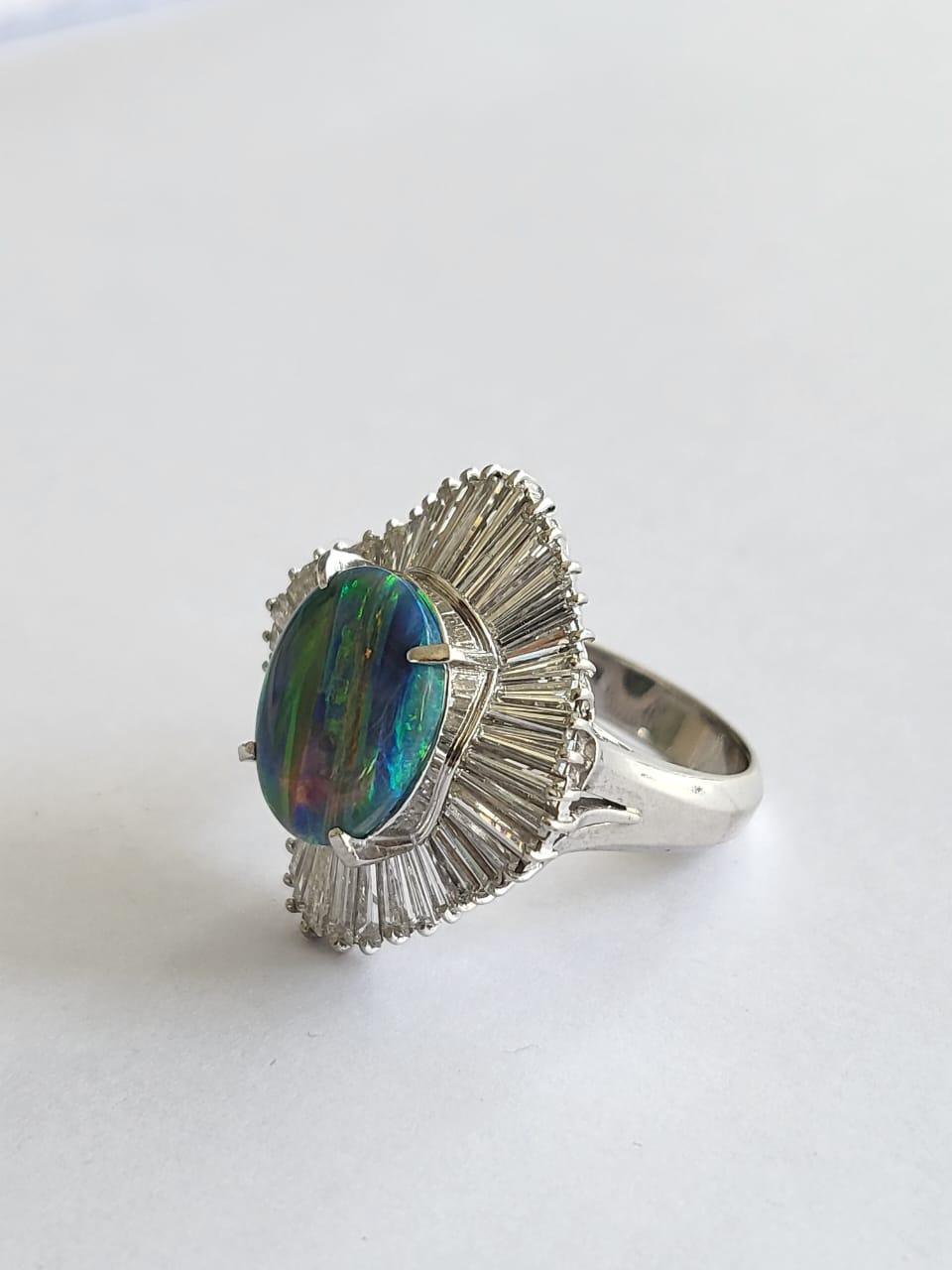 A very beautiful and gorgeous, Opal Engagement Cocktail Ring set in Platinum 900 & Diamonds. The weight of the Opal is 2.34 carats. The Opal is completely natural, without any treatment and is of Australian origin. The Diamonds weight is 2.05