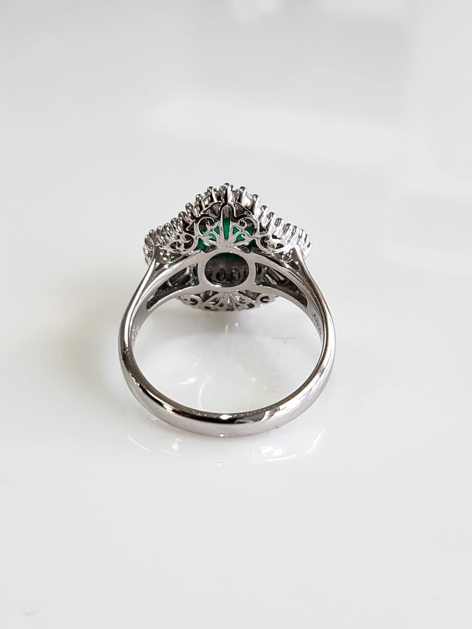 Tapered Baguette Set in PT900, 1.09 carats, natural Colombian Emerald & Diamonds Engagement Ring For Sale