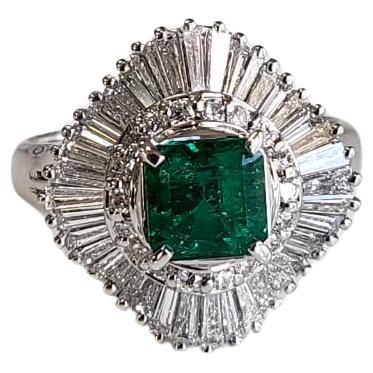 Set in PT900, 1.09 carats, natural Colombian Emerald & Diamonds Engagement Ring For Sale