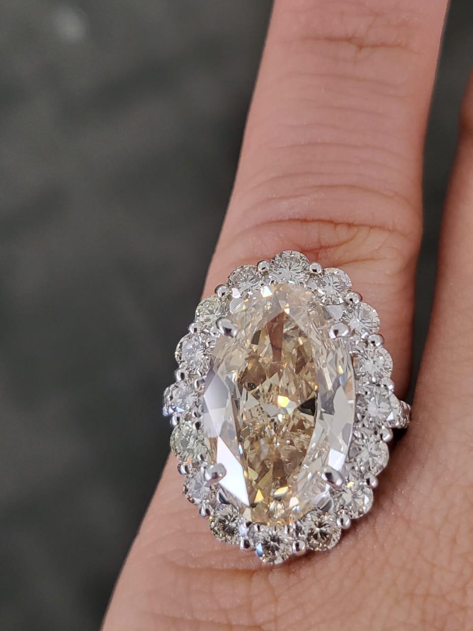 Modern Set in PT900, 6.15 carats, Slight Yellow Brown Oval Diamond Engagement Ring For Sale