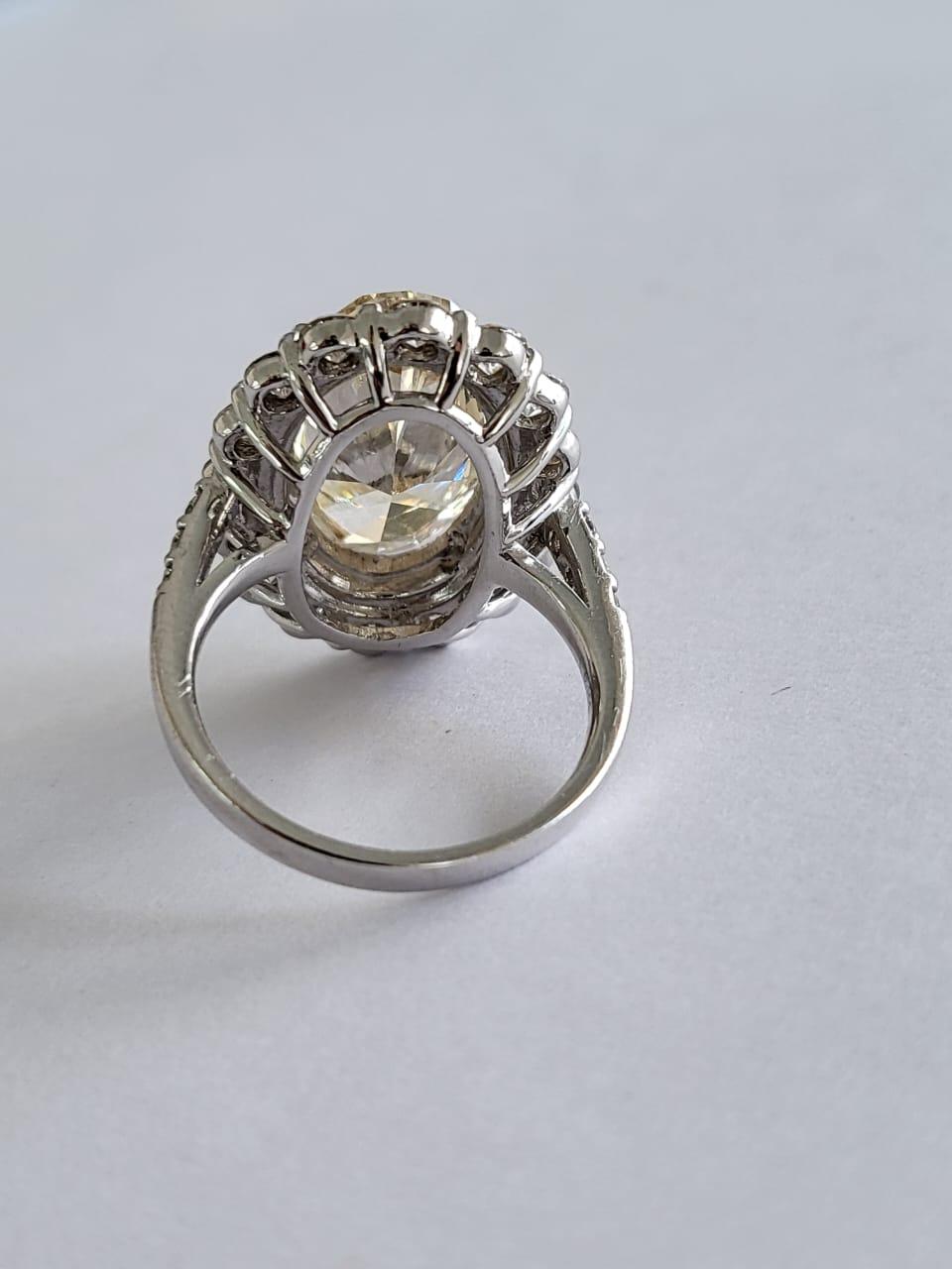 Set in PT900, 6.15 carats, Slight Yellow Brown Oval Diamond Engagement Ring In New Condition For Sale In Hong Kong, HK