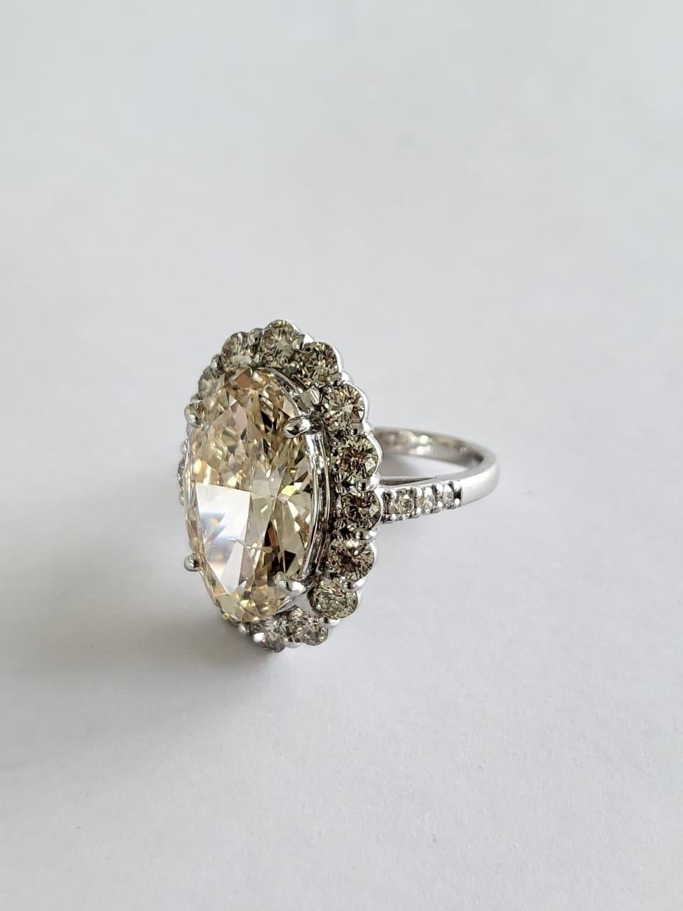 Women's or Men's Set in PT900, 6.15 carats, Slight Yellow Brown Oval Diamond Engagement Ring For Sale