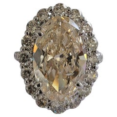 Used Set in PT900, 6.15 carats, Slight Yellow Brown Oval Diamond Engagement Ring