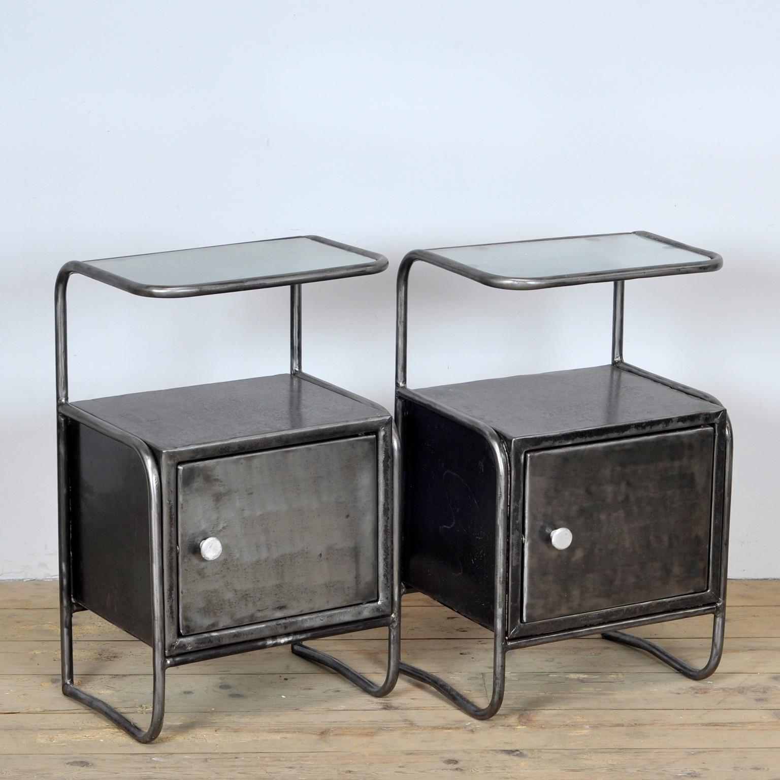 Set of iron hospital bedside tables with a glass top. The items have been stripped from its paint. Treated against rust. Circa 1950. 