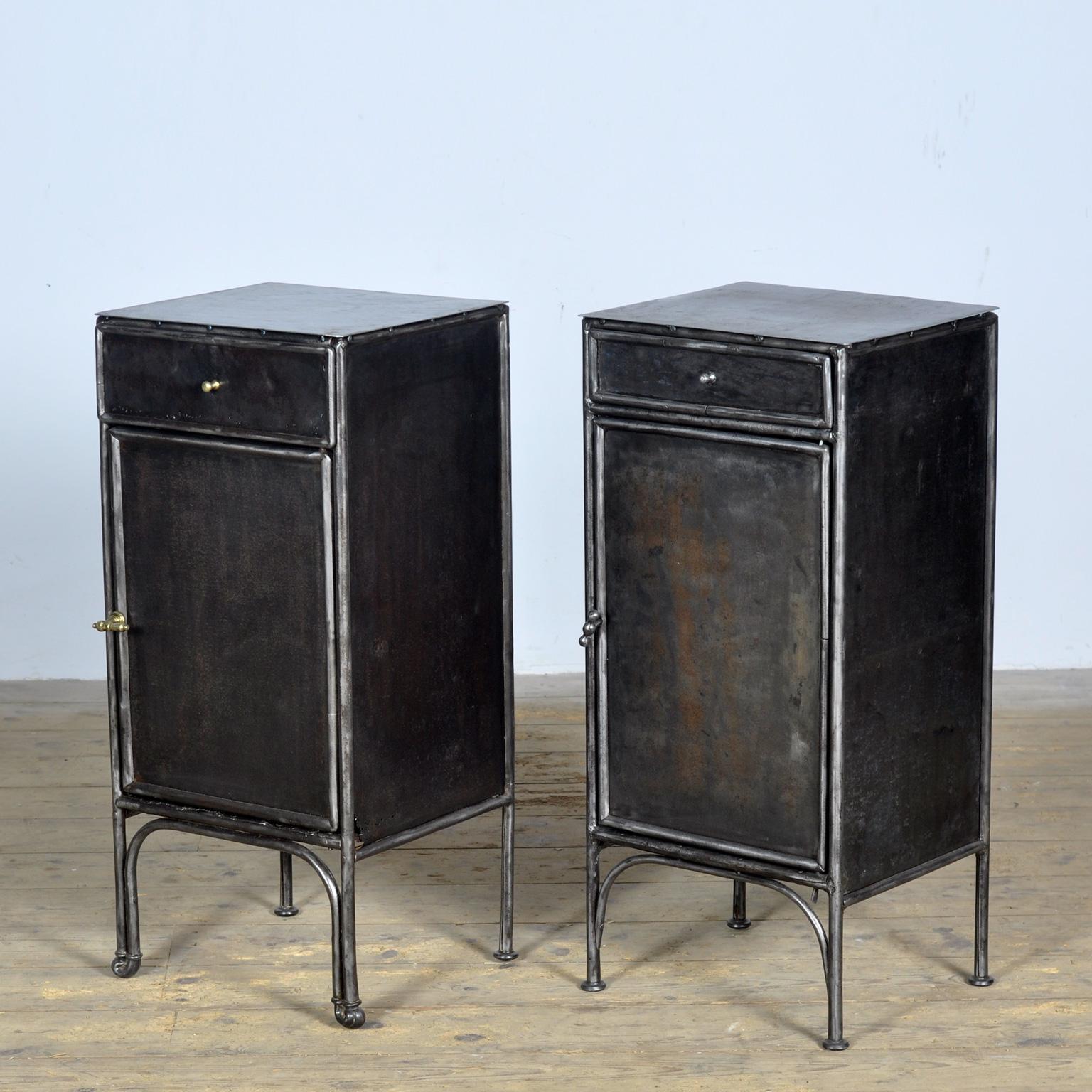 Set of bedside tables made of iron from a hospital in Budapest. Sold as a set but there are small differences in the cabinets such as the handles and legs. Stripped to the metal and polished. Circa 1910.