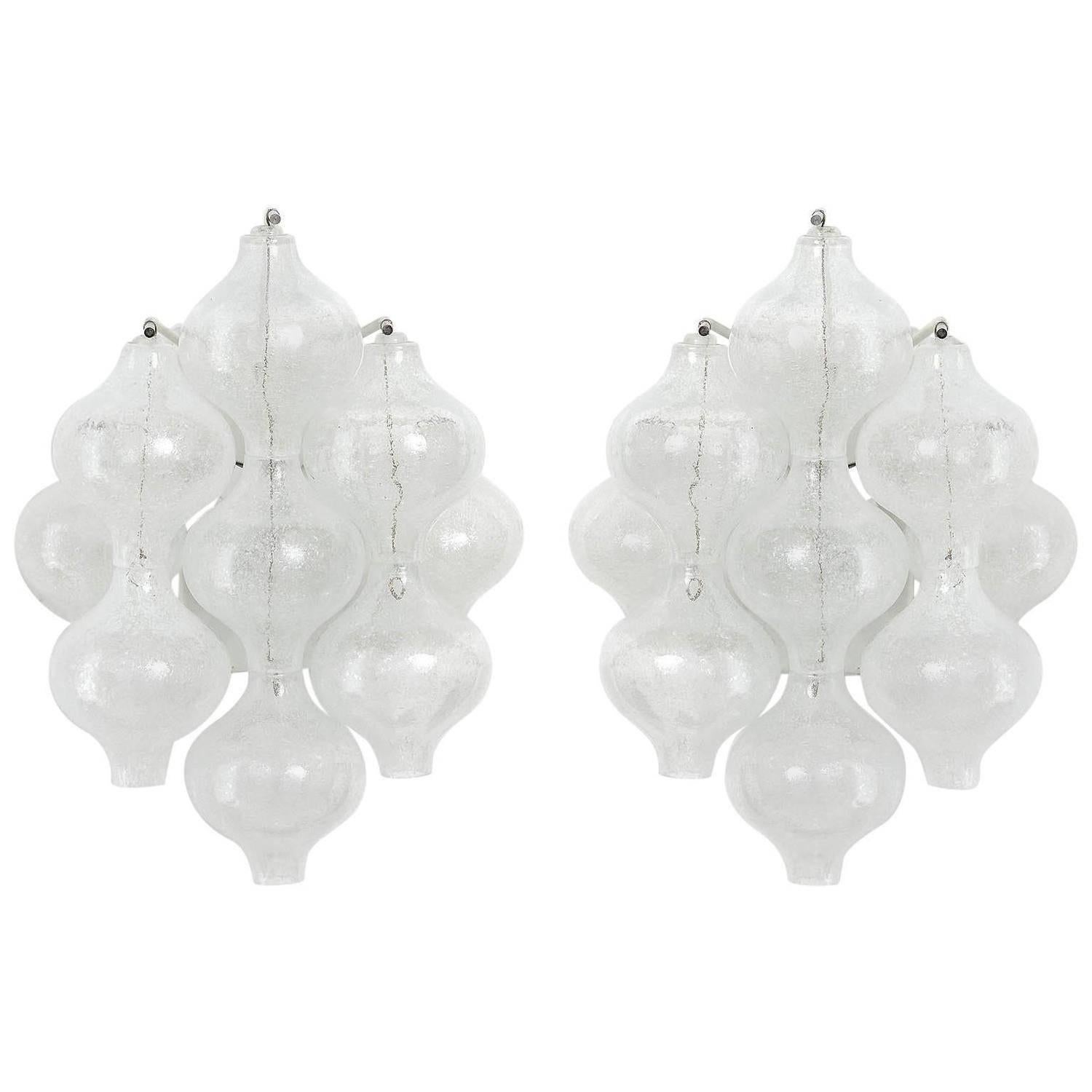 A set of a pendant light fixture model 'Tulipan' and a matching pair of wall lamps by J.T. Kalmar, Vienna, Austria, manufactured in midcentury, circa 1970, (late 1960s-early 1970s).
The name Tulipan derives from the tulip shaped hand blown bubble