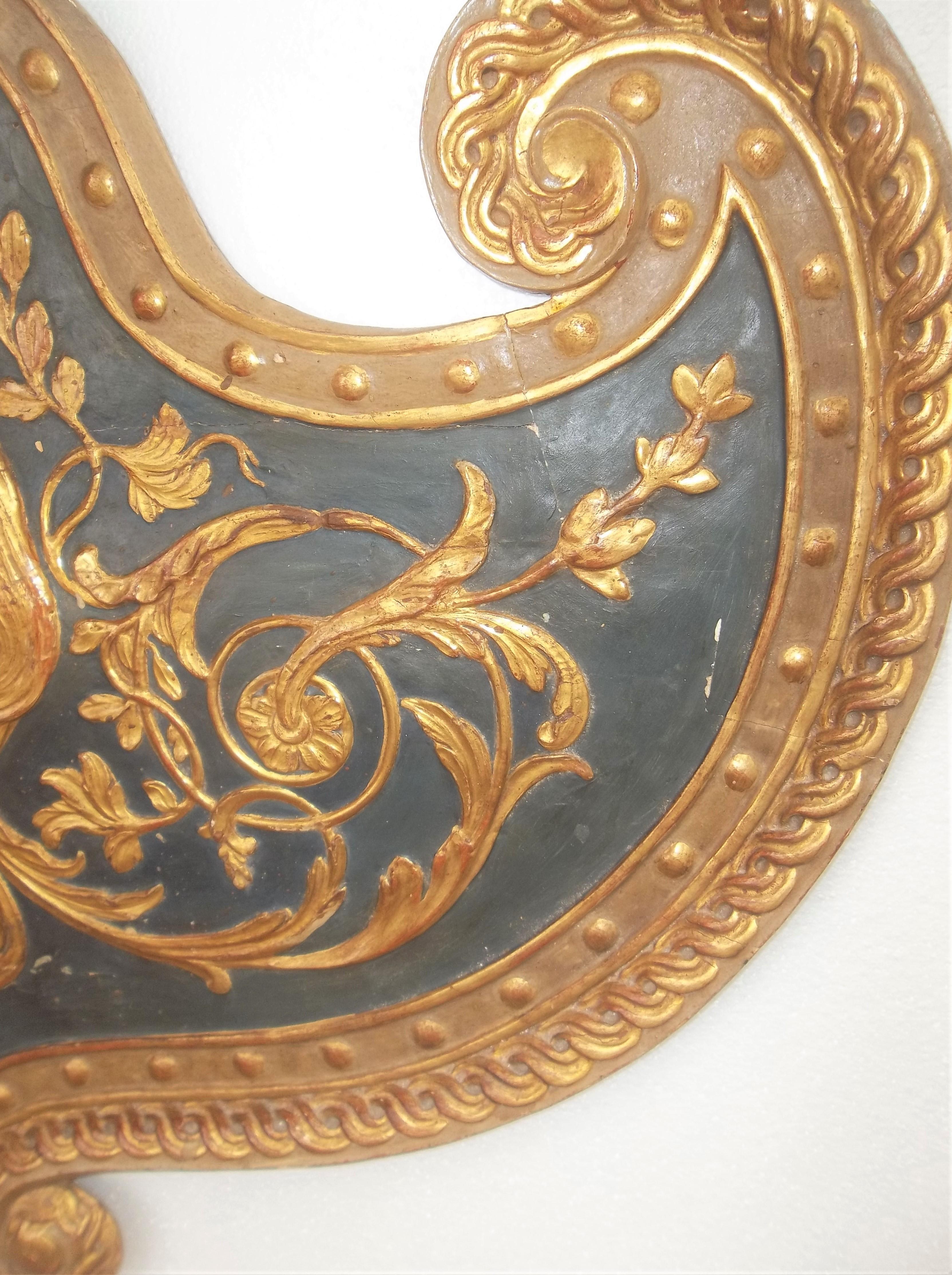 Wood Set Large Paint and Giltwood Shield Form Overdoor Appliques with Classical Faces