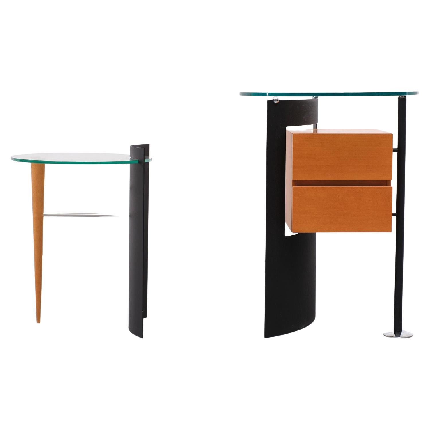 Unique set of side tables. Made by the same quality producer Leolux 
in the 1980s Netherlands. Very good condition and quality.
Post Modern in style. Half round Black enameled steel, Glass tops. Beech wood 
drawers and feet.