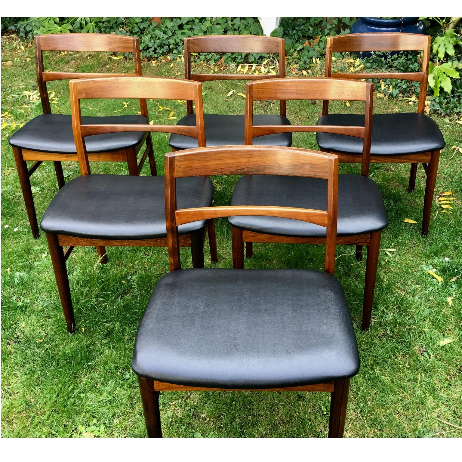 Set of 6 midcentury Danish dining chairs in rosewood by Henning Kjaernulf for Vejle Stole

Stunning set of 6 dining chairs designed by Henning Kjaernulf and manufactured by Vejle Stole- og Møbelfabrik (V S&M) in Denmark in the 1960s. The solid