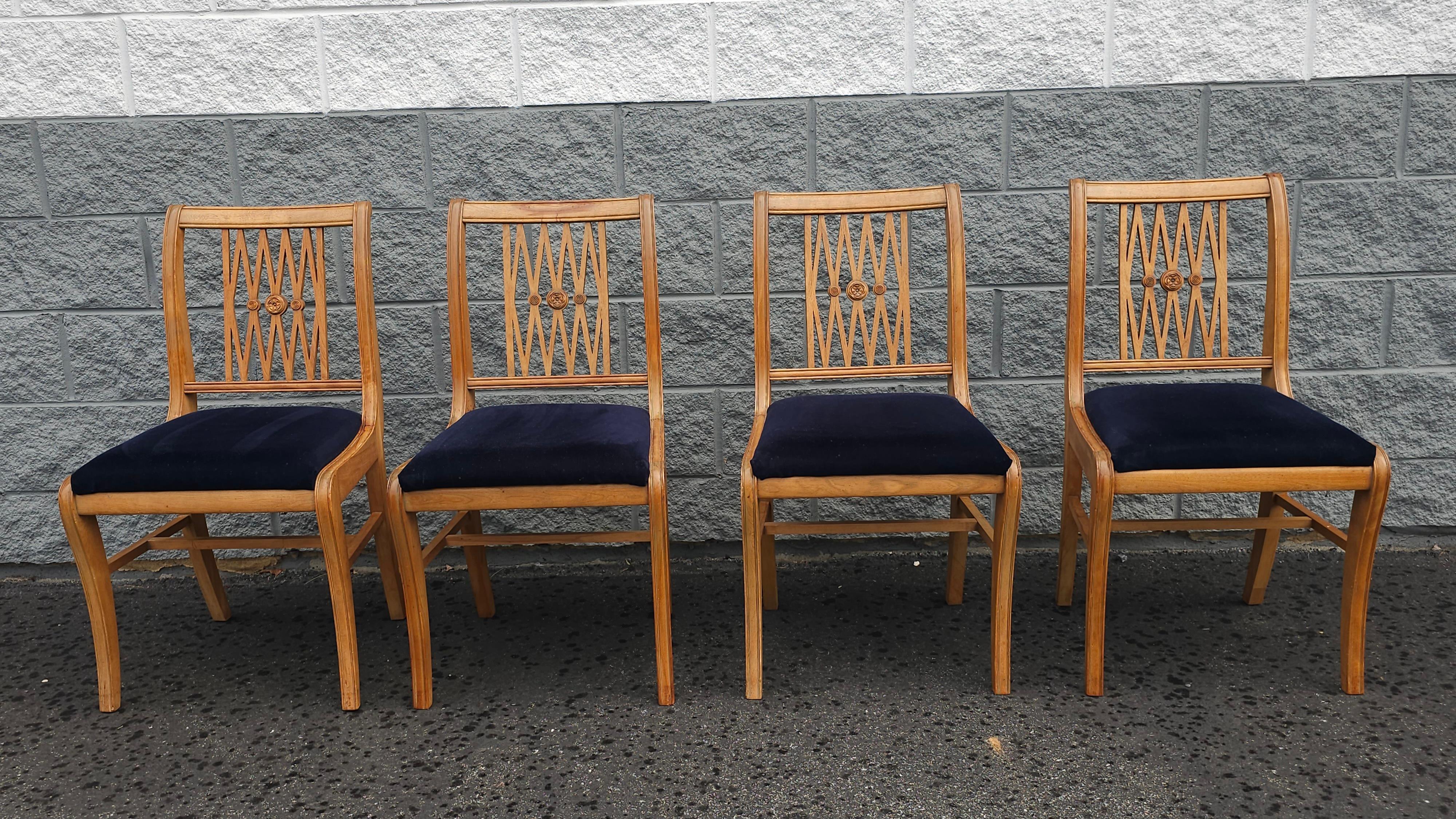 A Set of Four Mid-Century Duncan Phyfe Natural Maple and Velvet Re - Upholstered Dining Chairs. Navy velvet. Very sturdy and clean upholstery. Measures 19