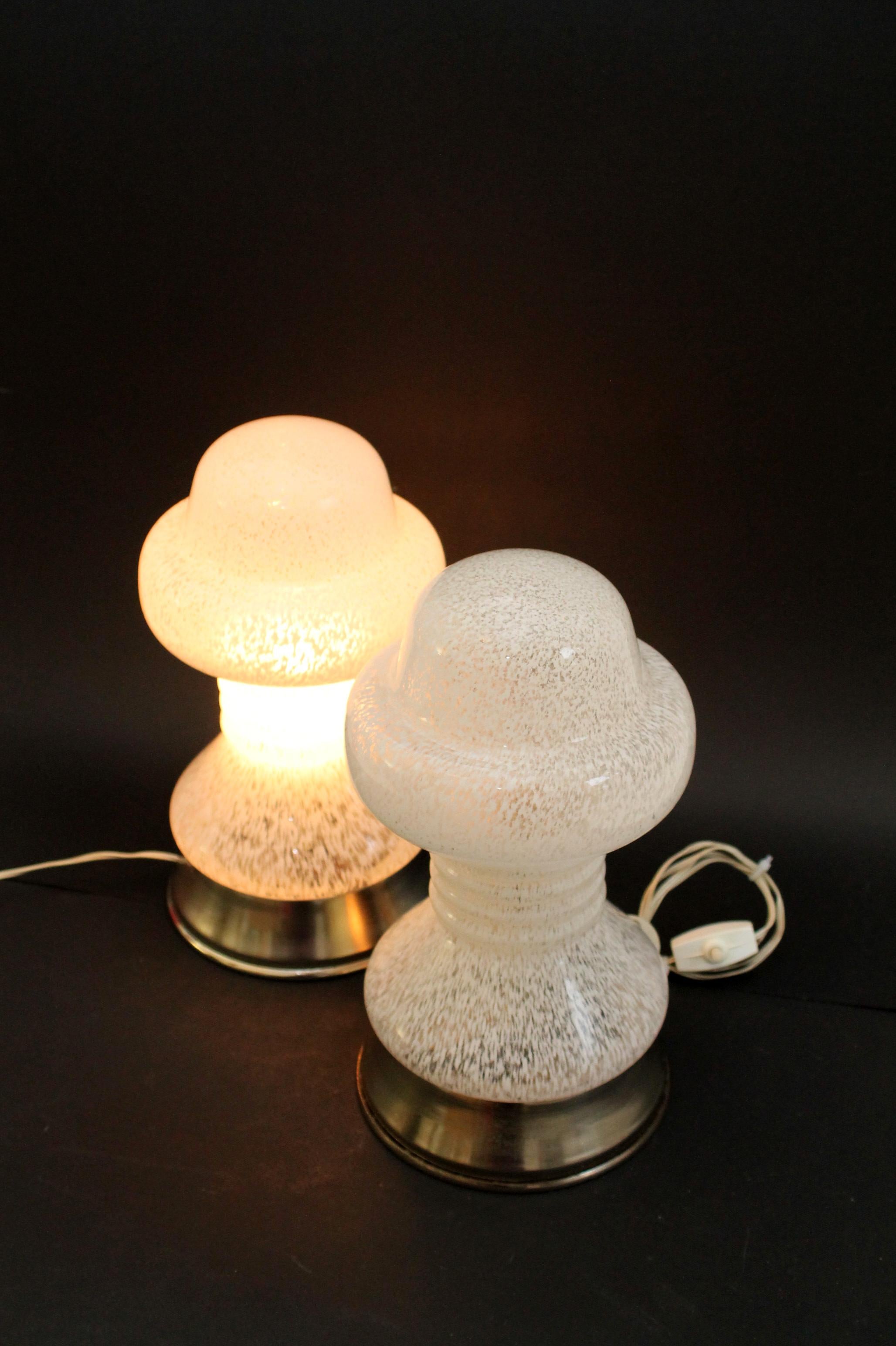 Set gorgeous small Murano original table/desk lamps

White/clear marble glass table lamp from 1970s. 
Technique: Hand blown. Made of a single sheet of handcrafted Murano glass
Measurements (cm): 28 height x 15 diameter
Single socket (E14) -