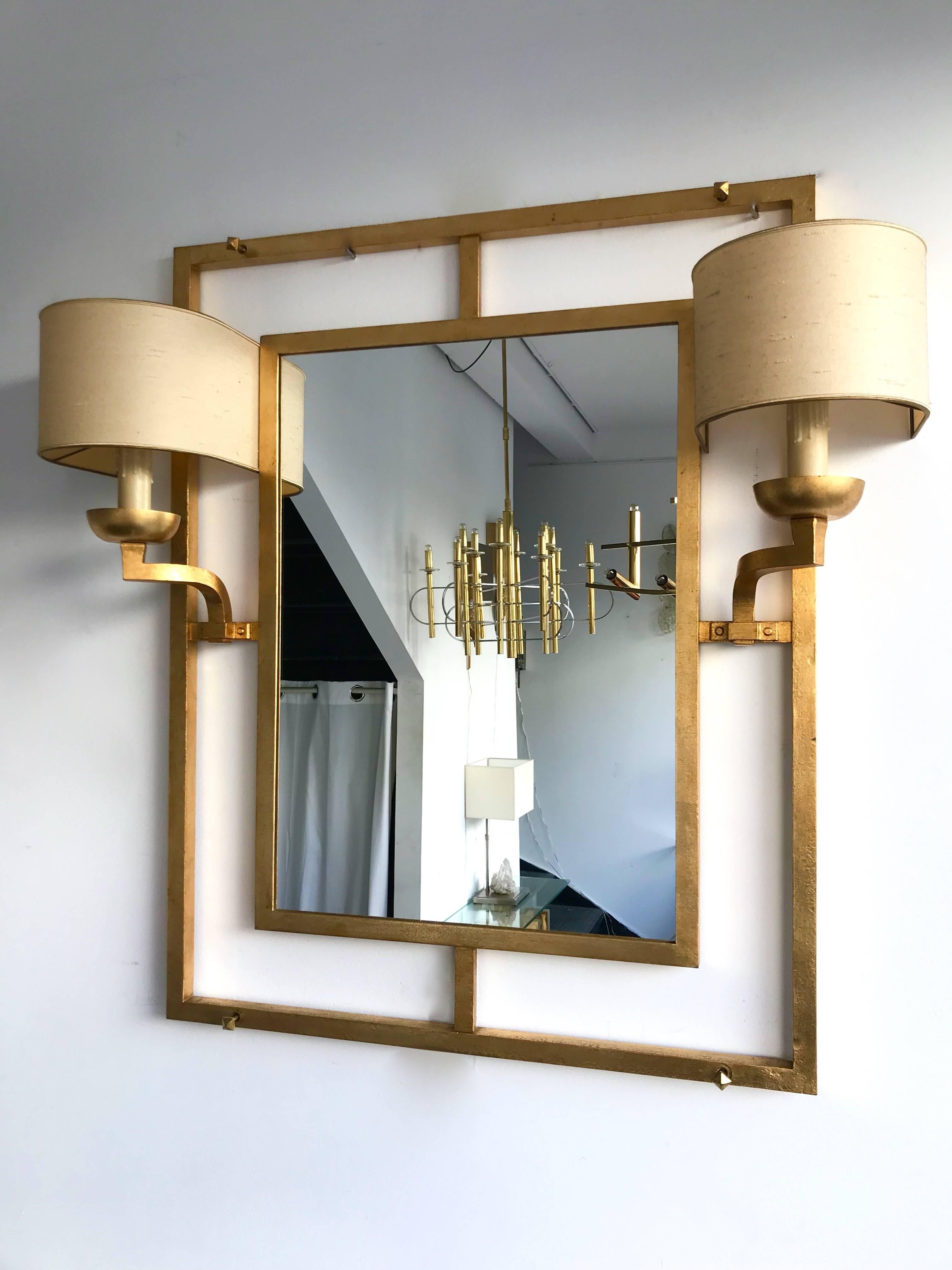 Very rare set console and unique piece lightning mirror with sconces wall lights by the French artist designer Robert and Roger Thibier, a special order from the 1960. Neoclassical style, Art Deco inspiration. Wrought iron and gold leaf. Very