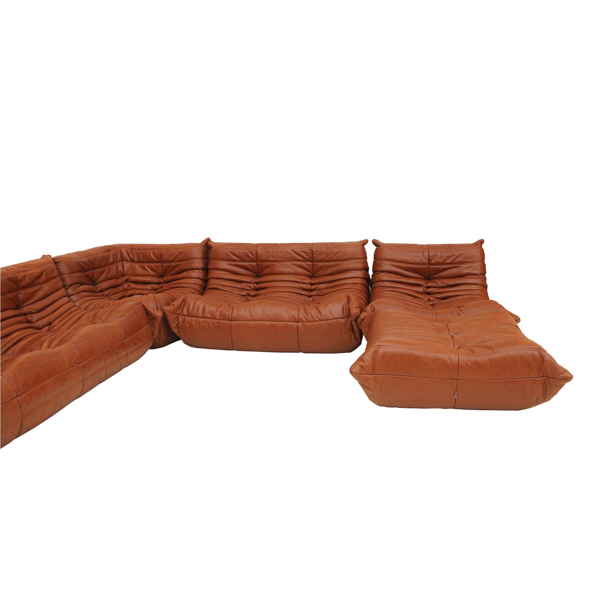 Set mod. Togo designed by Michel Ducaroy for Ligne Roset. Upholstered in brown leather. France 70's.

Double armchair size: W 120 x D 100 x H 35 / 70 cm
Corner sofa: W 100 x D 100 x H 35 / 70 cm (1 item) D 100 x H 35 / 70 cm
Individual armchair