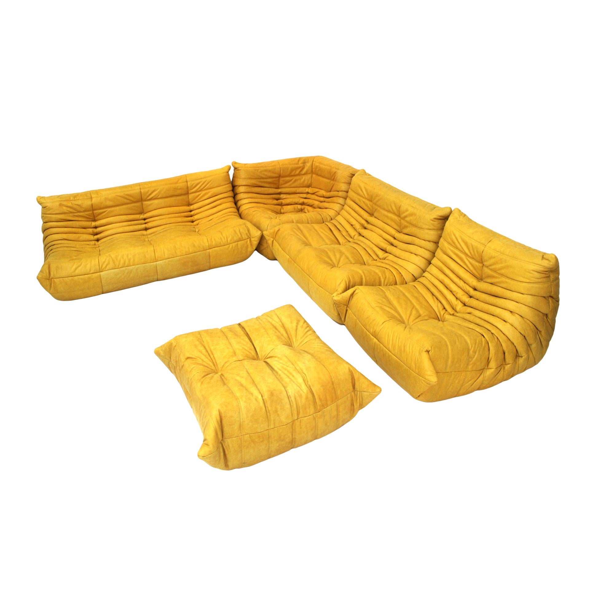 Set mod. Togo designed by Michel Ducaroy for Ligne Roset. Reupholstered in yellow leather. France 70's.

Dimensions: W265 x D 190 x H 35 / 70 cm

Double armchair size: W 120 x D 100 x H 35 / 70 cm
Corner sofa: W 100 x D 100 x H 35 / 70 cm (1 item) D