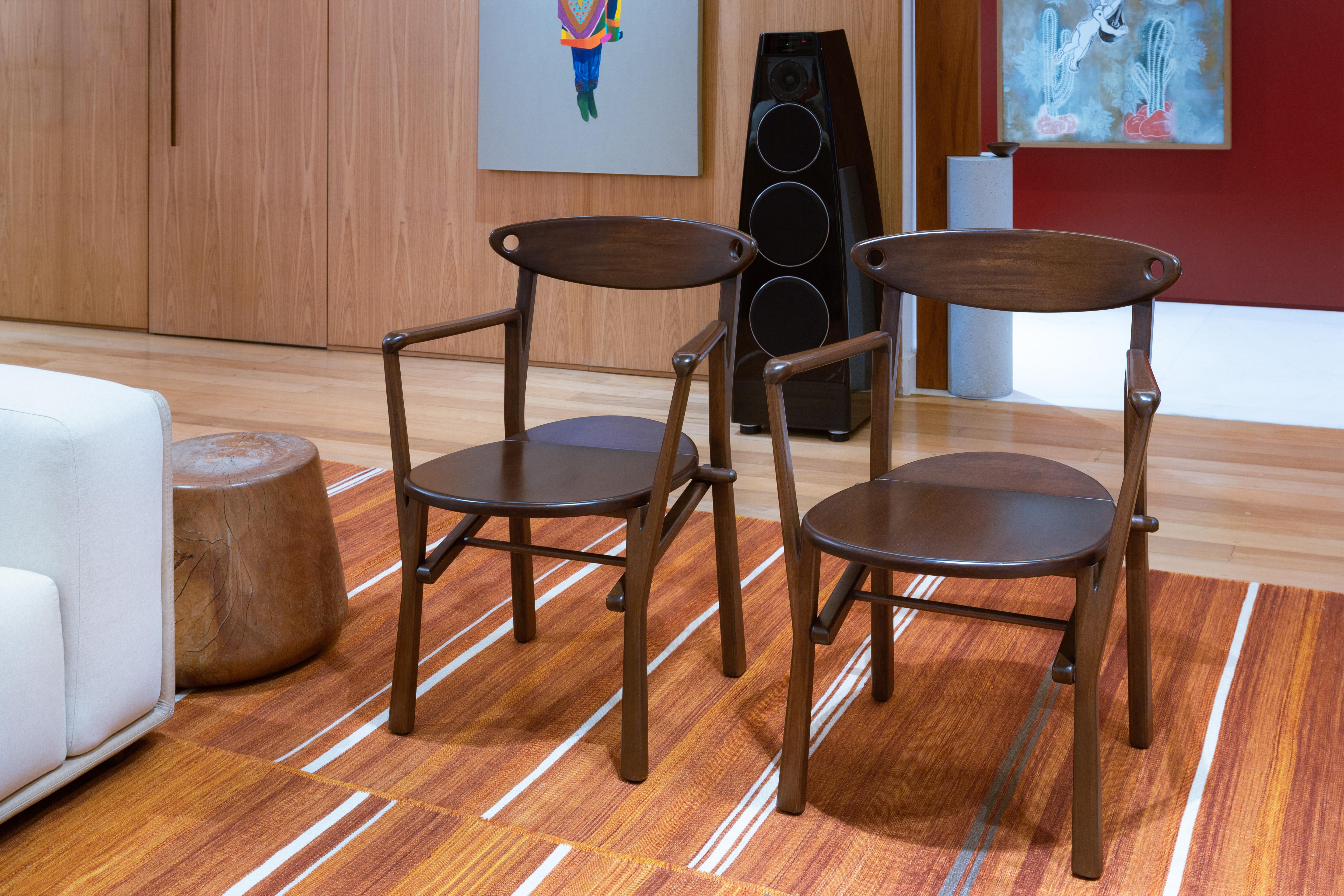 This set of two Laje chairs in Dark Brown Finish Wood, is available for immediate shipping.


The LAJE chair pays homage to collective groups of people living in the outskirts of the big cities from Brazil, which are generally known for their unique