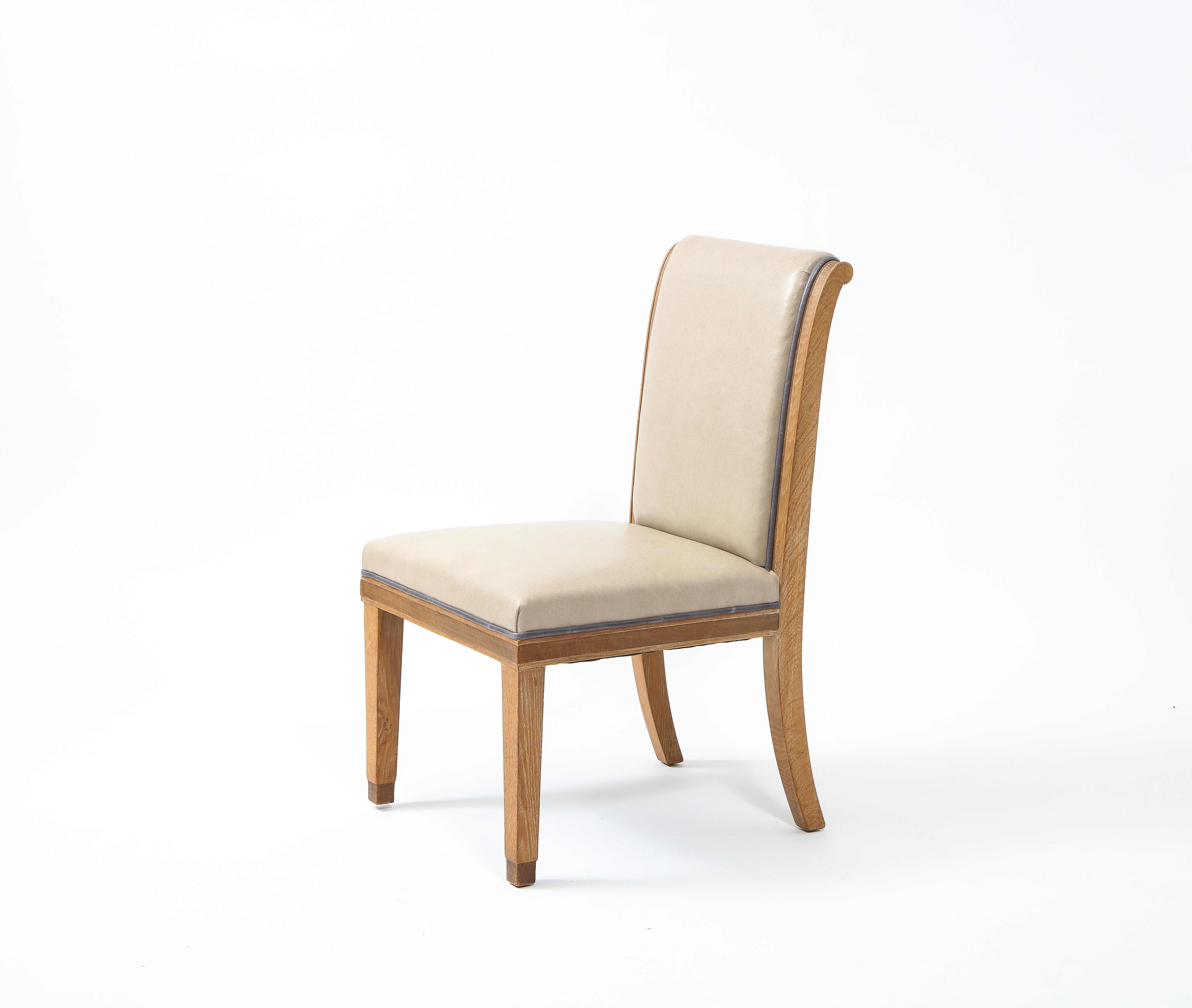 A set of 10 custom dining chairs designed in the French Art Deco tradition after Leleu and Ruhlmann, among the most prominent visionaries behind the movement that defined French design in 1930's and 1940's. These simple, classic forms are well