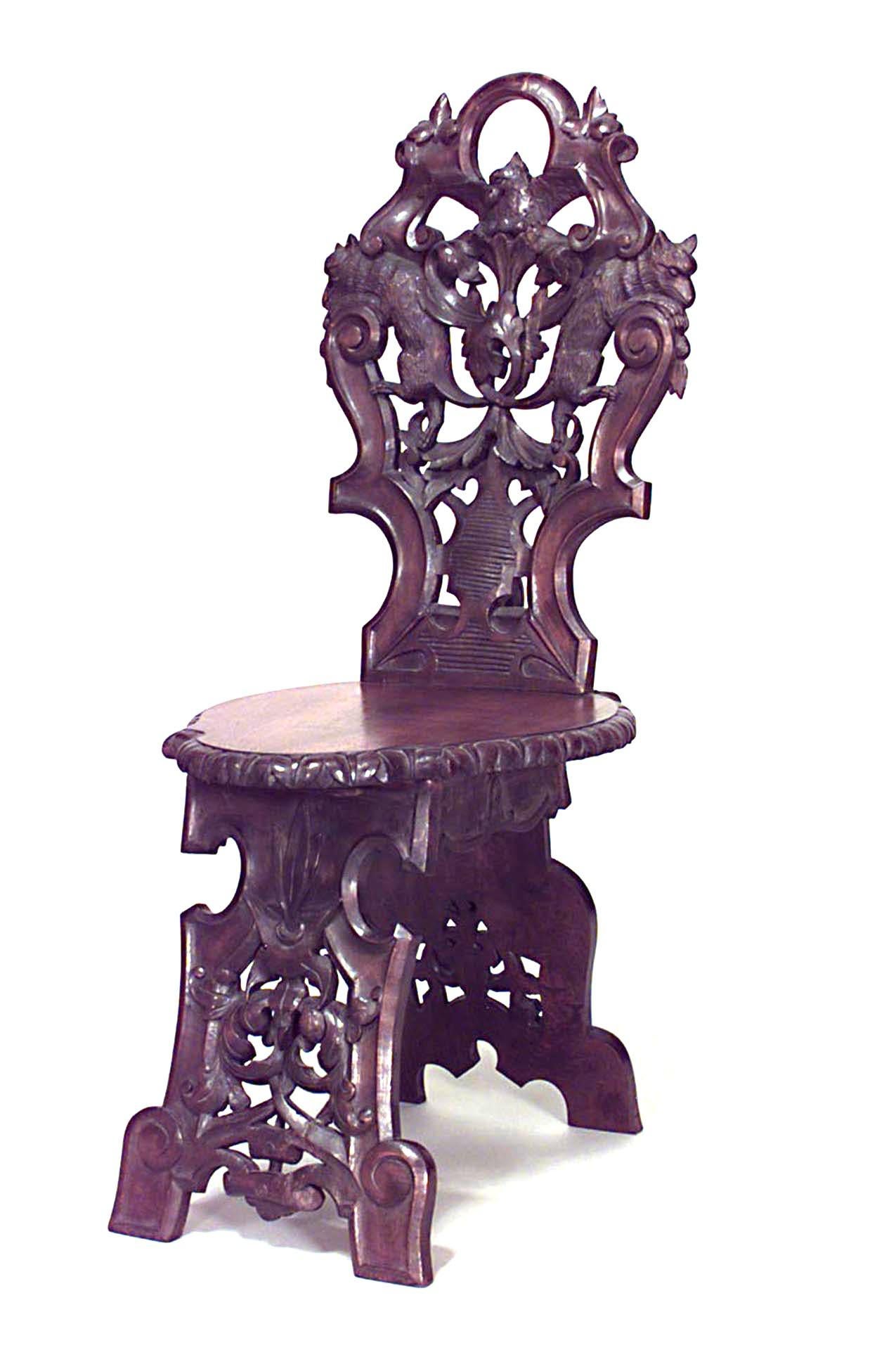 Set of 10 Rustic Black Forest (19th Cent) walnut side chairs with shaped seat and back with filigree carving and animals.
