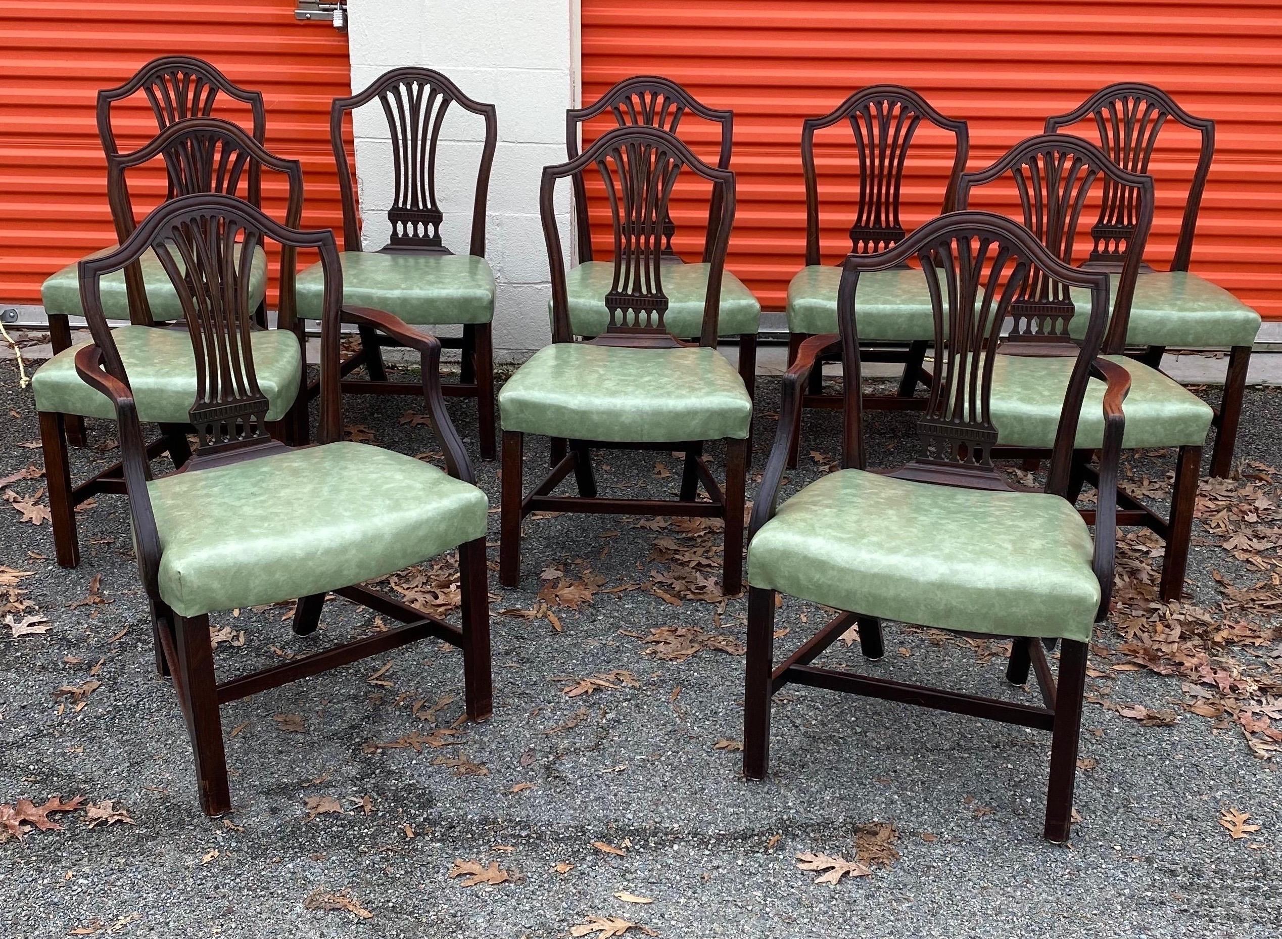 Great set of 10 19th century English mahogany dining chairs with light green seats. Two armchairs, eight side chairs. Upholstered in a lovely light green vinyl in good condition.