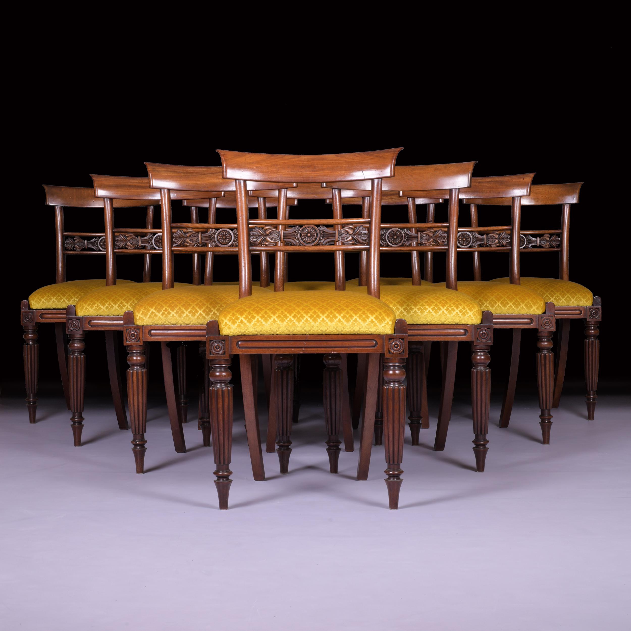 A superb quality set of 10 George IV Gancalo Alves dining room chairs with plain concave top rails, scroll moulded horizontal slats on reeded tapering legs with drop in seats upholstered in a very fine velvet material.

Circa 1828

English.