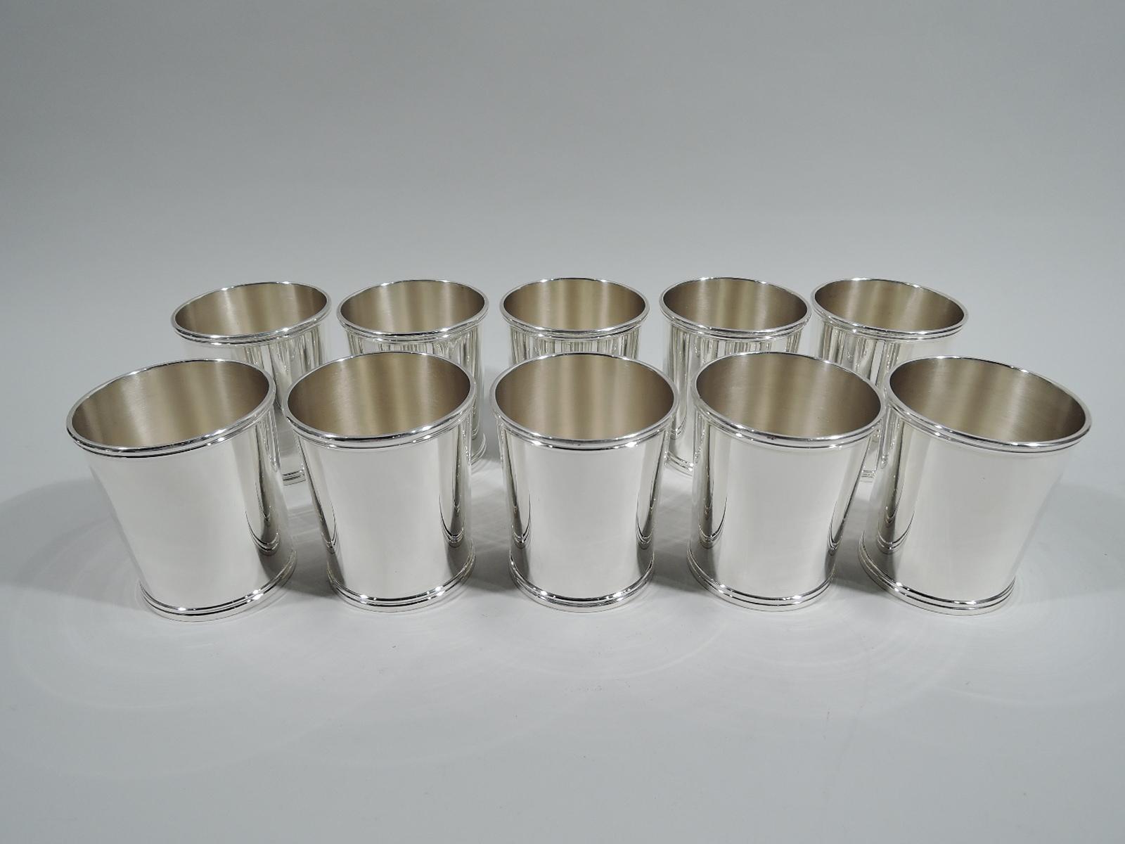 Ten sterling silver mint juleps. Made by Chicago Silver Company. Each: Straight and tapering sides and molded rim and base. A stylish set by a noted regional maker that was active from 1925-50. Fully marked and numbered 351. Total weight: 45 troy