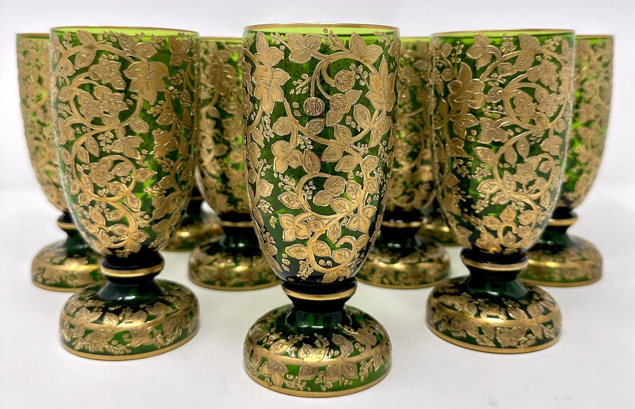 Set of 10 Antique German Gold Encrusted Green Glass Pilsner or Water Glasses Made by Moser Company, Circa 1890-1910.  
Per the last photo, we have a matching set of 10 white wine glasses and a set of 8 red wine glasses which are listed and sold