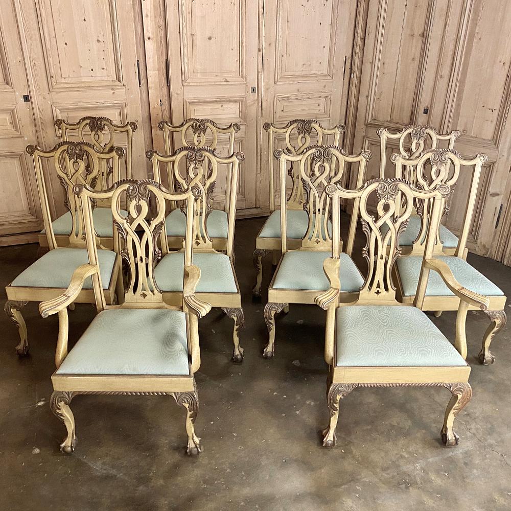Set of 10 antique gilded Chippendale dining chairs includes 2 armchairs, and display all the timeless elegance for which the style is known! Regal seatbacks with intertwined motif and acanthus flourishes lead the eyes down to the contoured armrests