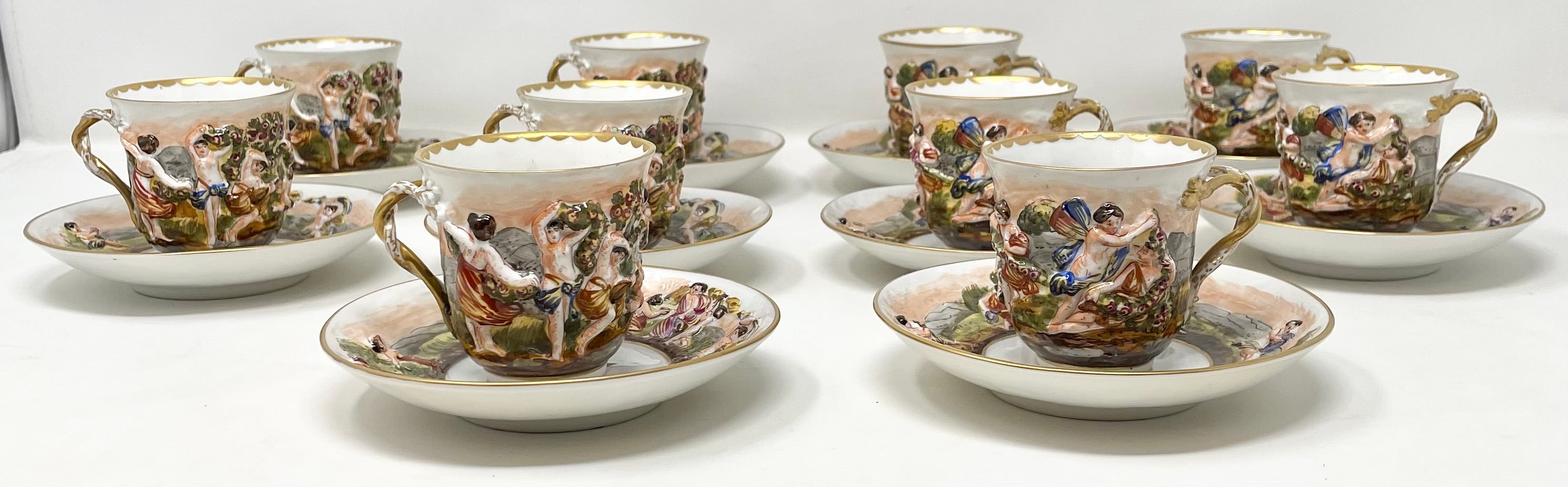 Antique Italian set of 10 Capo di Monte porcelain demi-tasse cups & saucers, circa 1880-1890.
Cup: 2.25