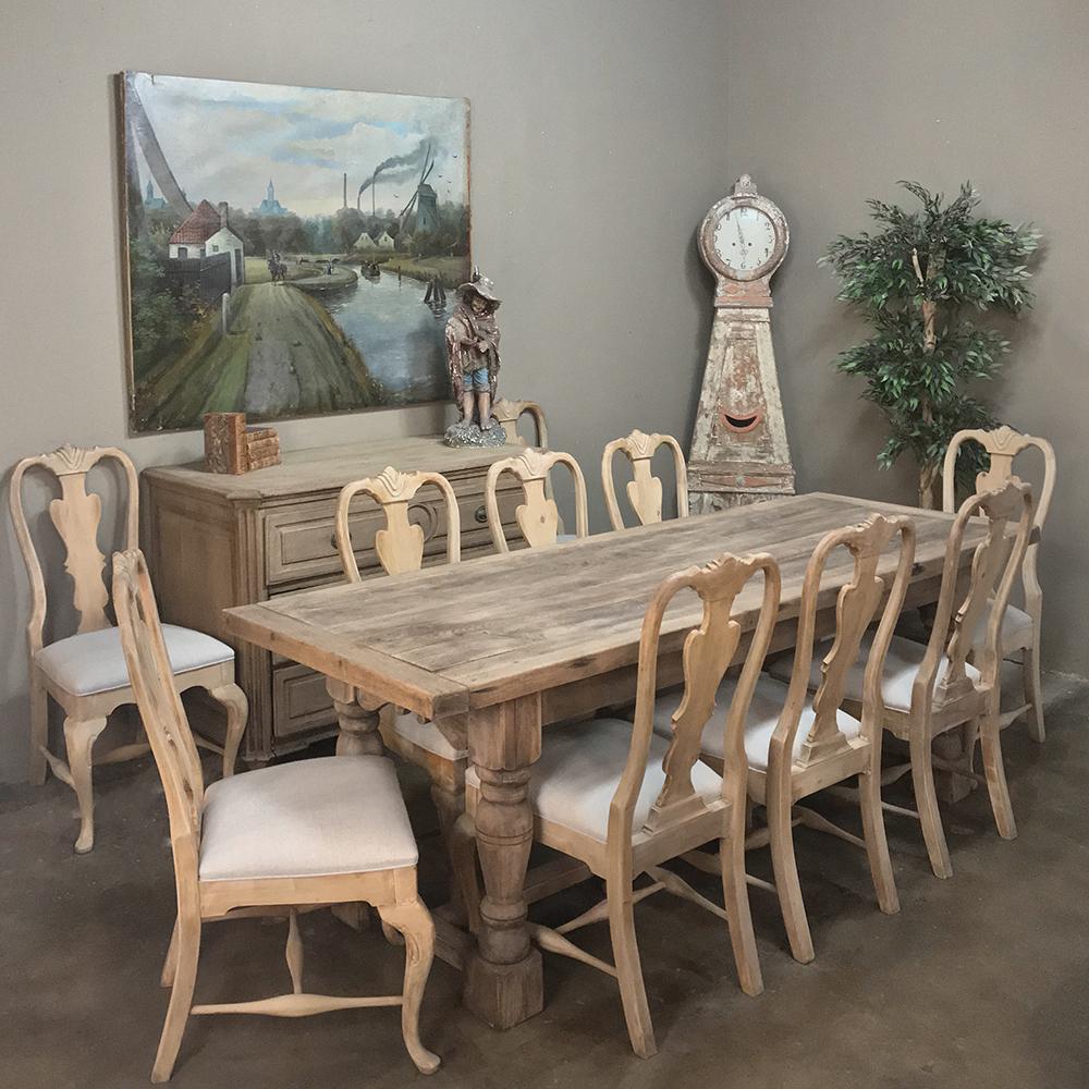 Set of 10 Antique Swedish Stripped Dining Chairs have been newly upholstered in a lovely neutral grey fabric that is so in vogue right now! The stripped finish on the chairs makes them ideal for todays decor of elegant dining room! 
Lovely details