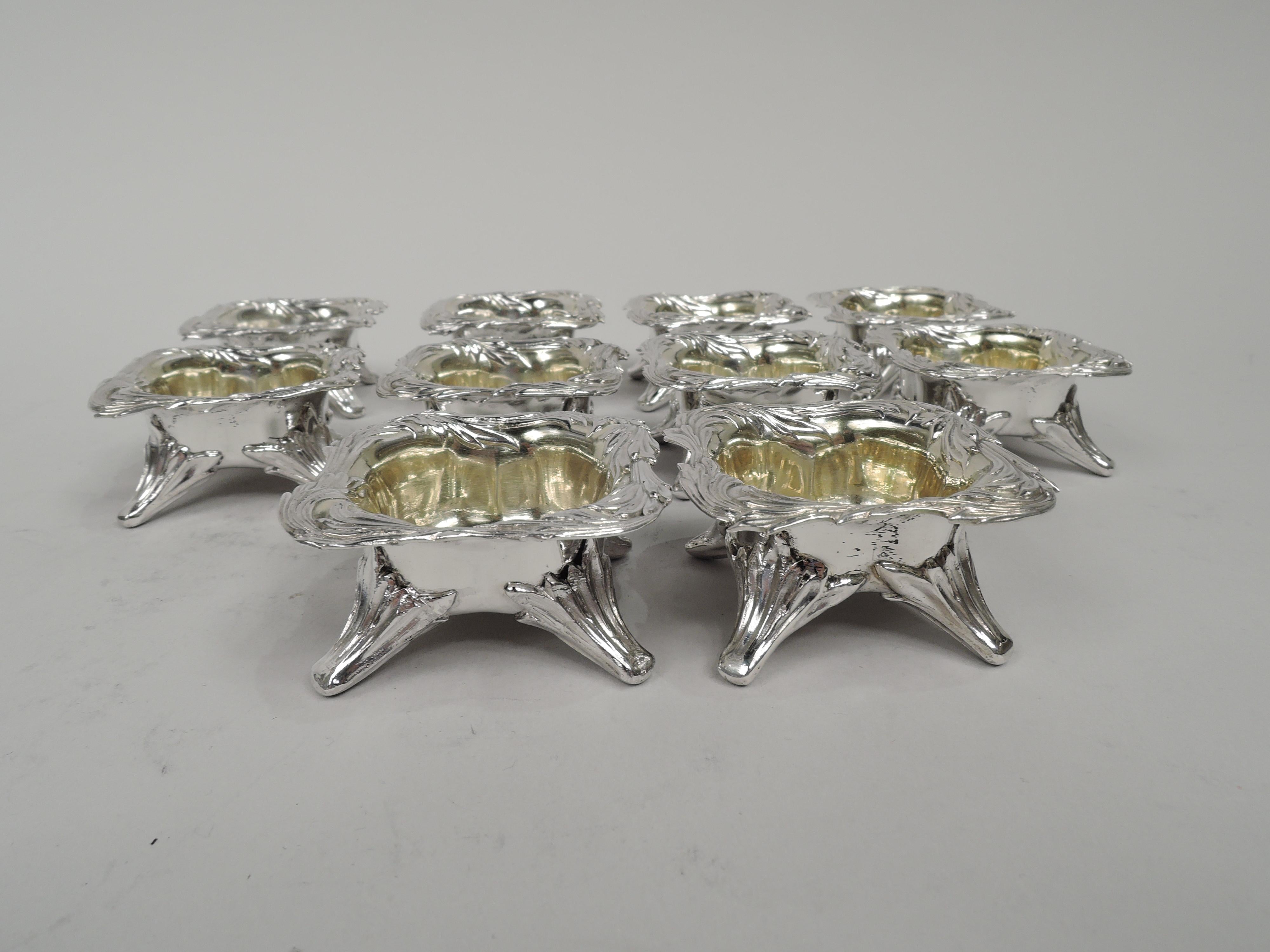 Set of 10 Chrysanthemum sterling silver open salts. Made by Tiffany & Co. in New York. Each: Lobed and gilt washed bowl in square frame with irregular shaggy leaf rim. Splayed corner leaf supports. Gorgeous pieces in modish late 19th-century