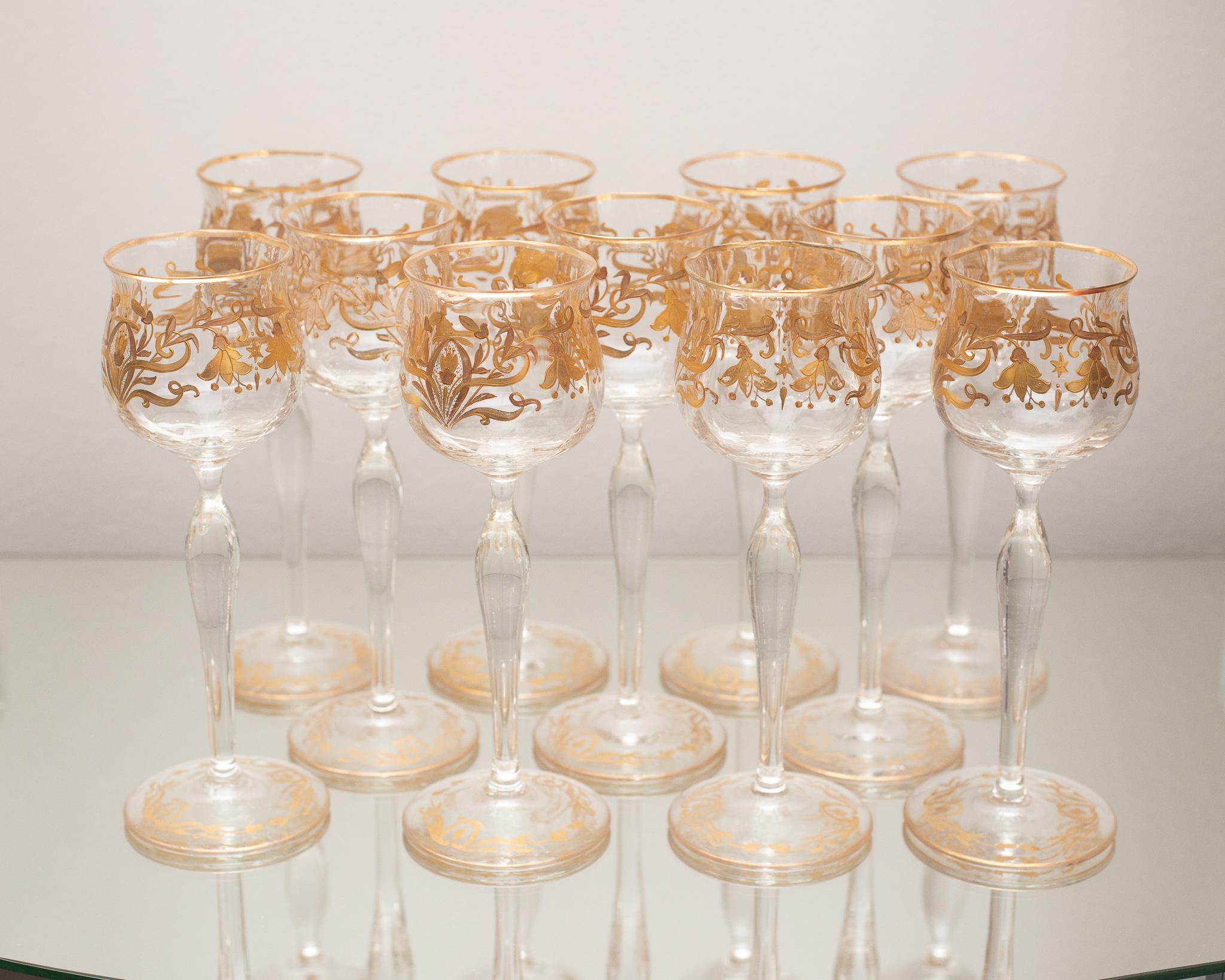 An exquisite set of 10 antique Venetian wine glasses with gold leaf gilded detail. Both rare and difficult to source in complete sets, these wine glasses are smaller than their contemporary glasses of today, typical of barware at the turn of the