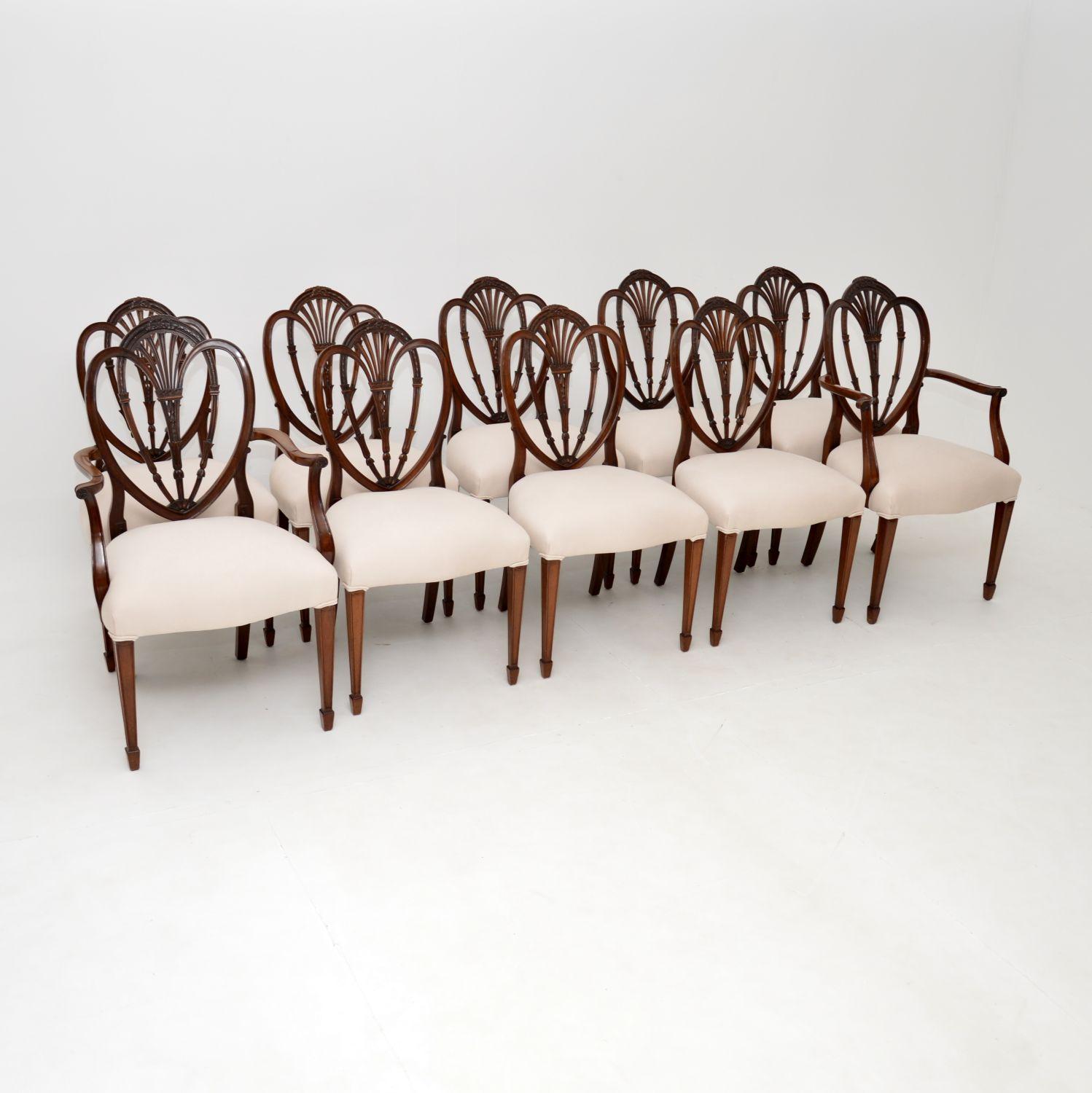 An outstanding set of ten antique solid wood dining chairs with a classic Hepplewhite shield back design. These were made in England, they date from around the 1880-1900 period.

They are of exceptional quality, with beautiful detailed carving on