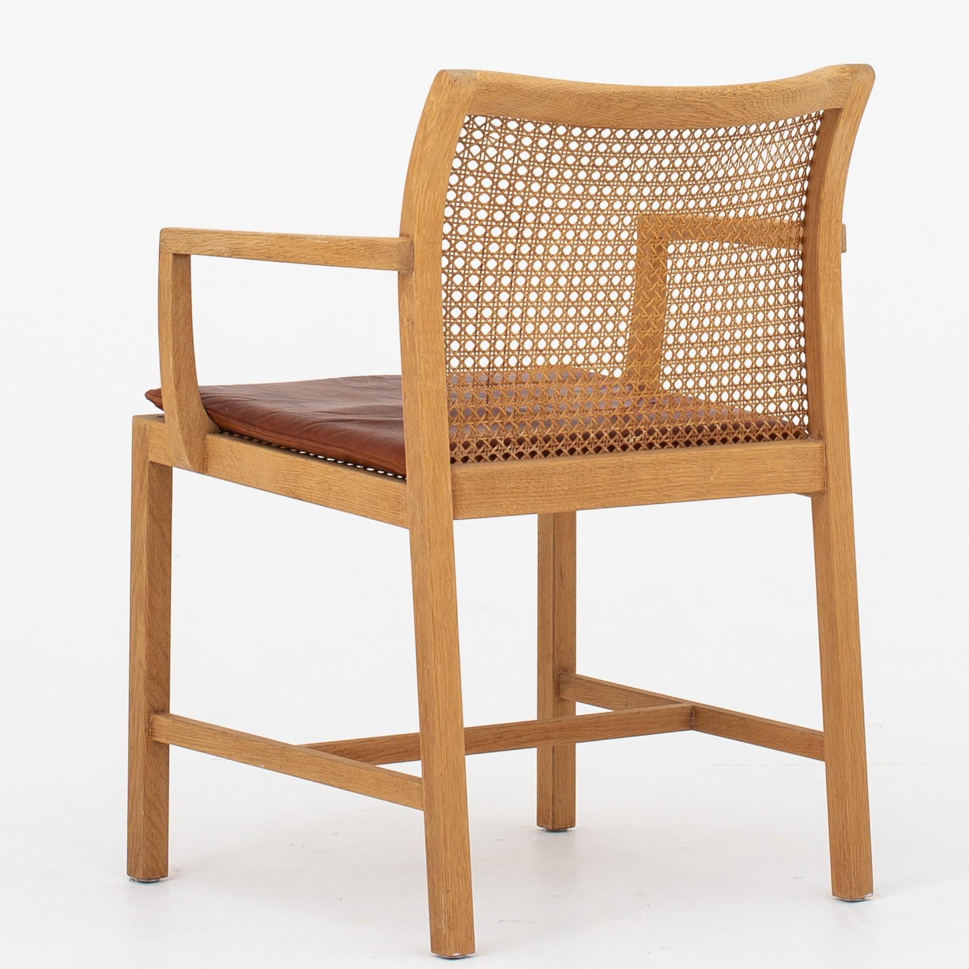 Dining chairs in oak, cane and red leather. Set of 10. Maker Søren Horn.