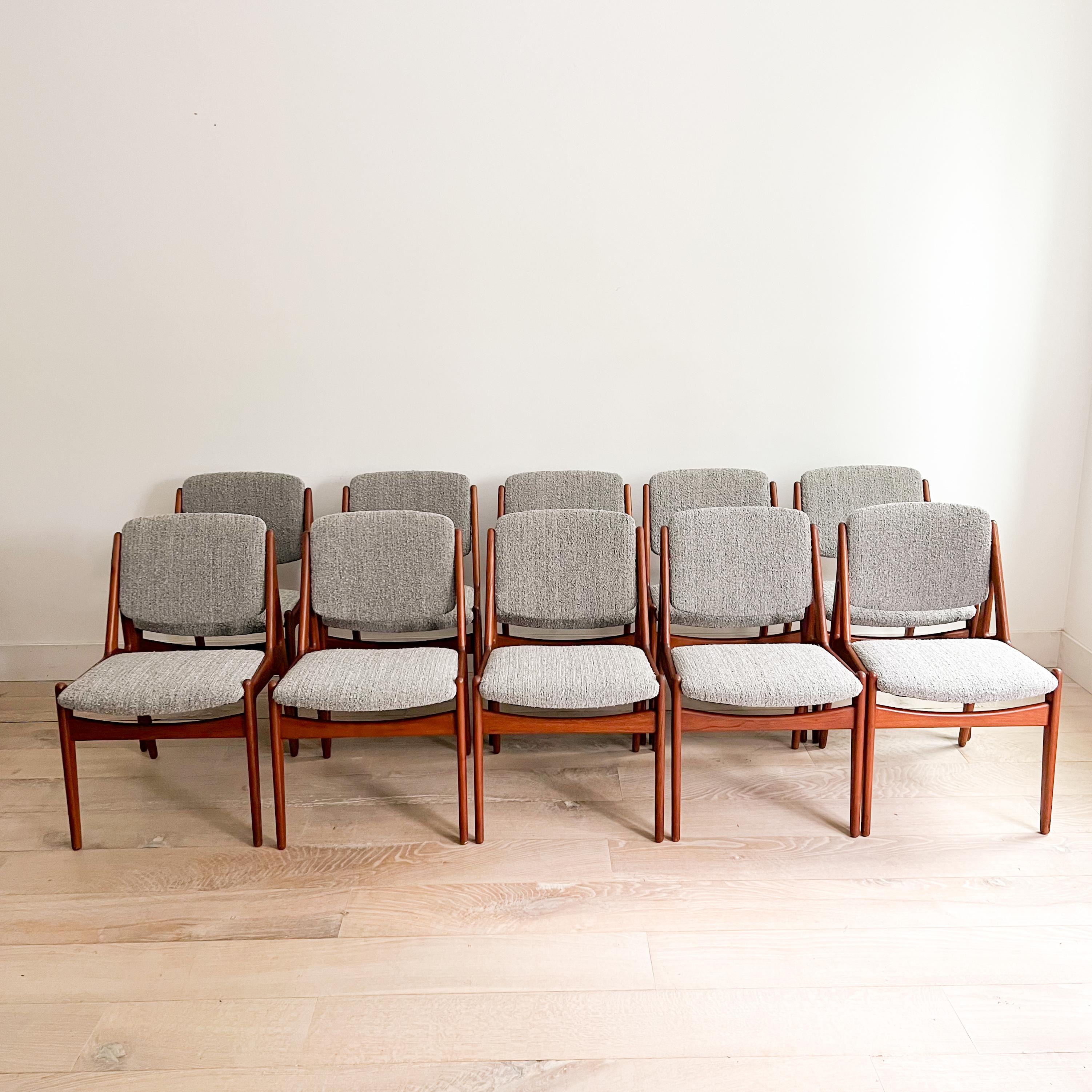 This rare set of 10 dining chairs by renowned designer Arne Vodder features elegant teak frames with a tilt-back design. Recently updated with new webbing, foam, and luxurious grey boucle upholstery, these chairs are incredibly comfortable. The teak