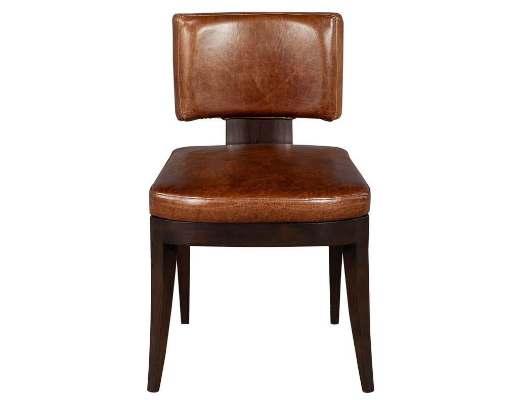 Set of 10 Art Deco inspired leather dining chairs. These neo-deco side chairs are a Carrocel custom piece. The frames are composed of rich espresso finished maple with curved rectangular back rests and thick curved wood base. Featuring a unique