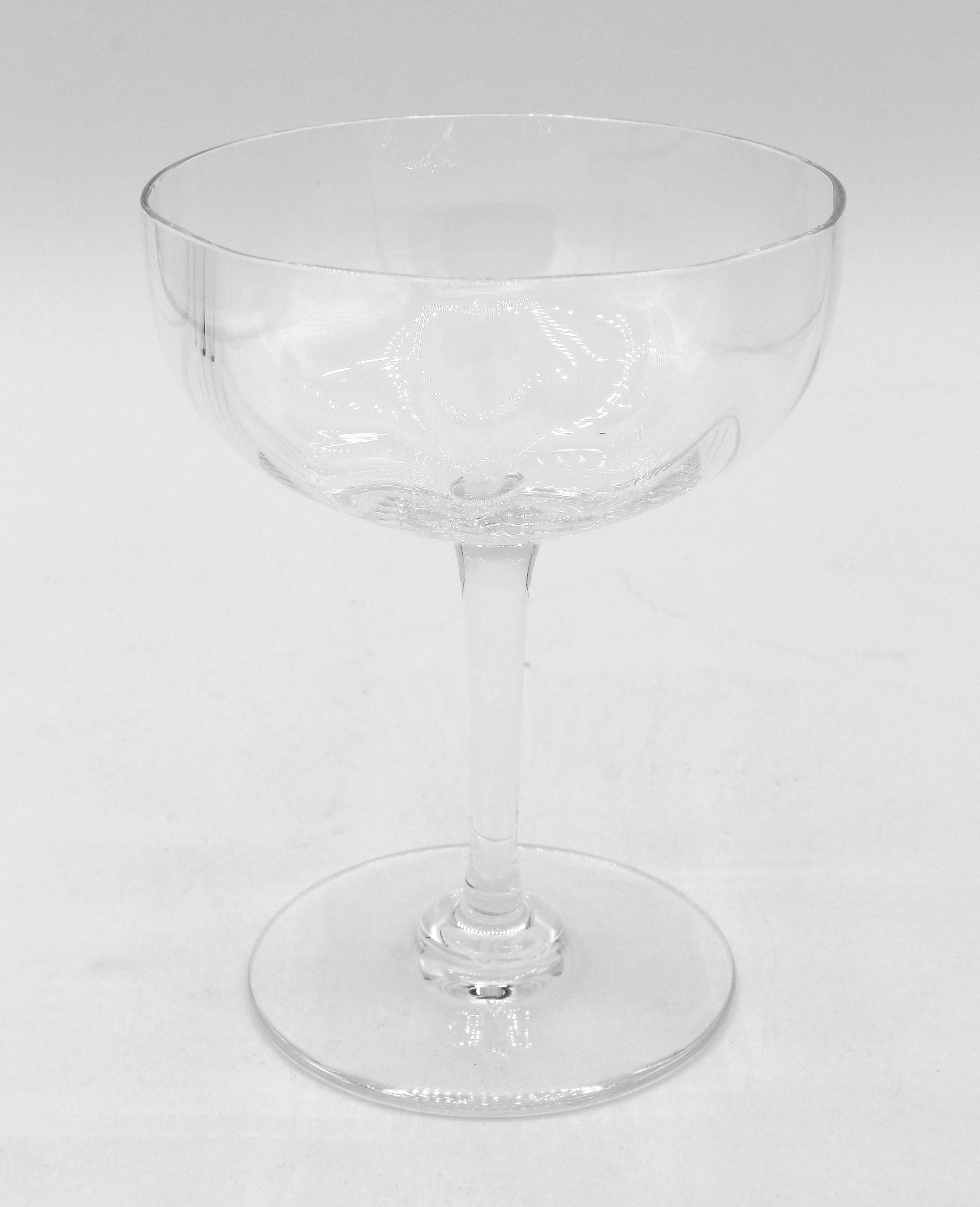 Set of 10 Baccarat Montaigne Optic tall champagne coupes or sherbets. Each signed. Classically traditional yet modern design, mouth blown with molded inner ridges creating the shimmering effect. Introduced in the late 19th century, they are now
