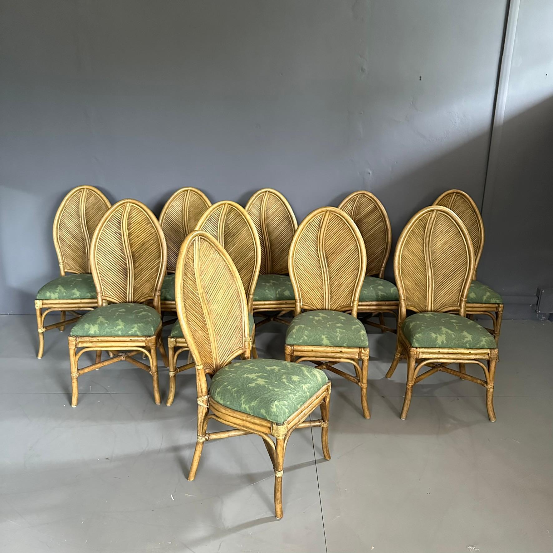 Set of 10 bamboo chairs with leaf-shaped backrests, 1970s, Neocolonial style
The chairs have a bamboo frame with natural weaves, and the high backrest has an elongated leaf shape.
The seat is padded with green fabric.
Possible attribution: Vivai del