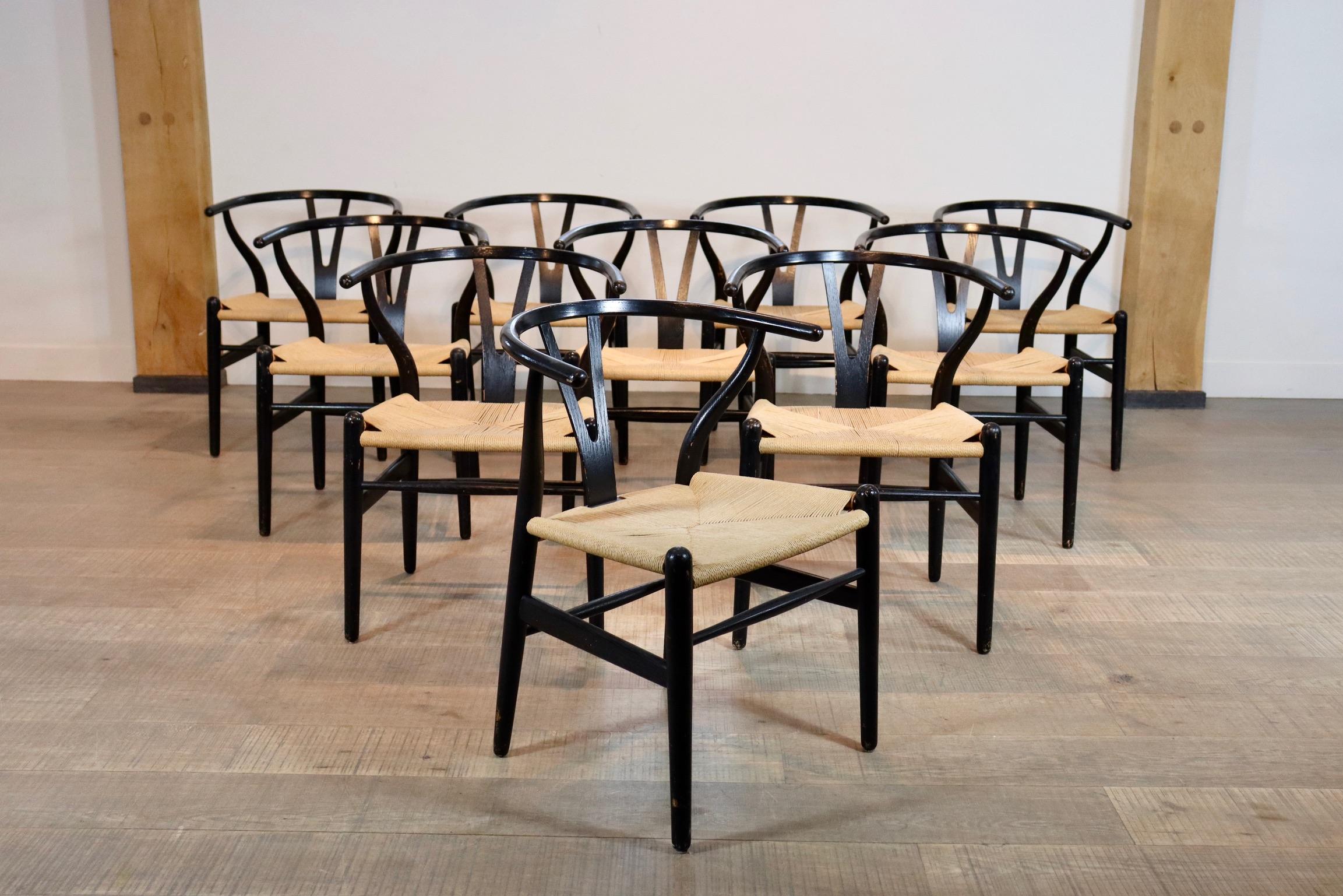 Gorgeous set of 10 vintage CH24 wishbone chairs with black frame by Hans J. Wegner. The chairs have original papercord seating and a solid oak frame that has been originally painted black. All chairs are marked 

Dimensions: H73 x W56 x D46cm