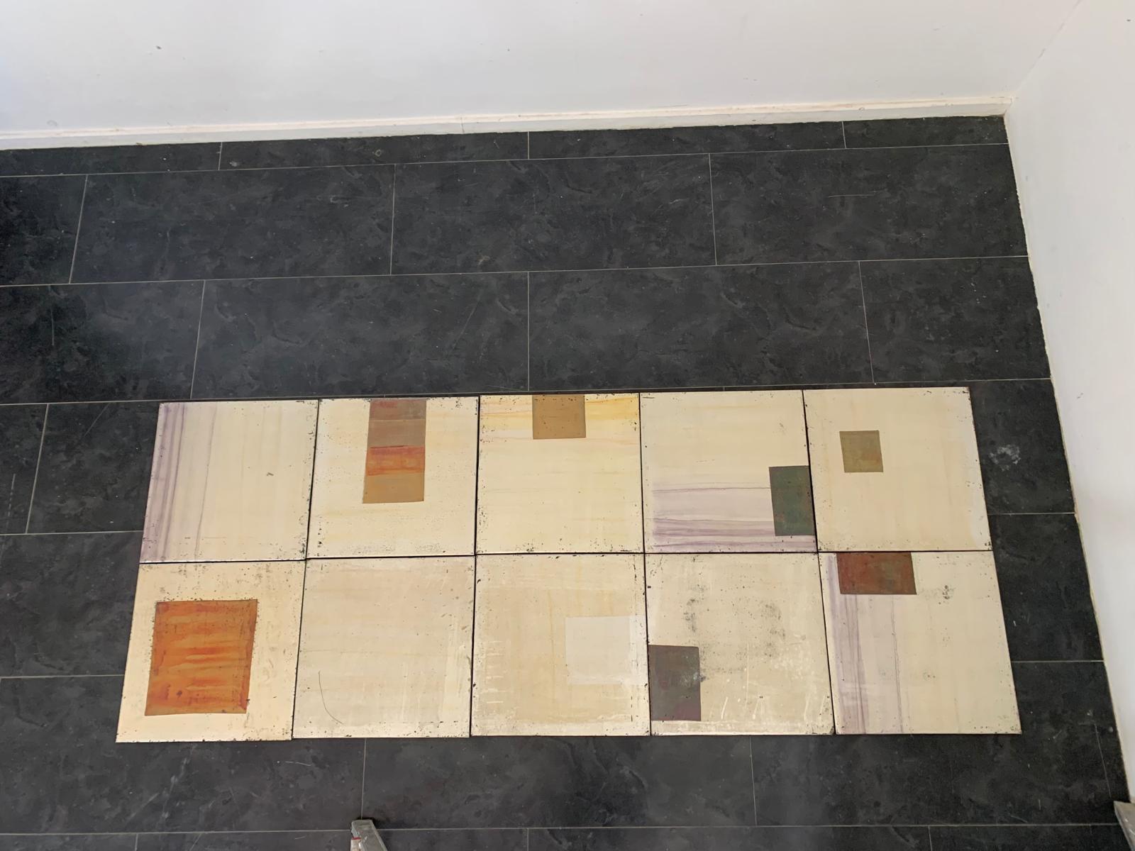 This unique set of 10 boxed panels features an exquisite finish, treated with iridescent metallic paints that create a striking color-changing effect. The panels exhibit visible signs of aging, which only add to their charm, evoking a sense of