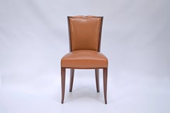 Set of 10 chairs and 2 armchairs by Maurice Jallot