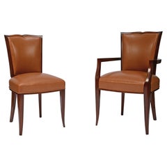 Set of 10 chairs and 2 armchairs by Maurice Jallot