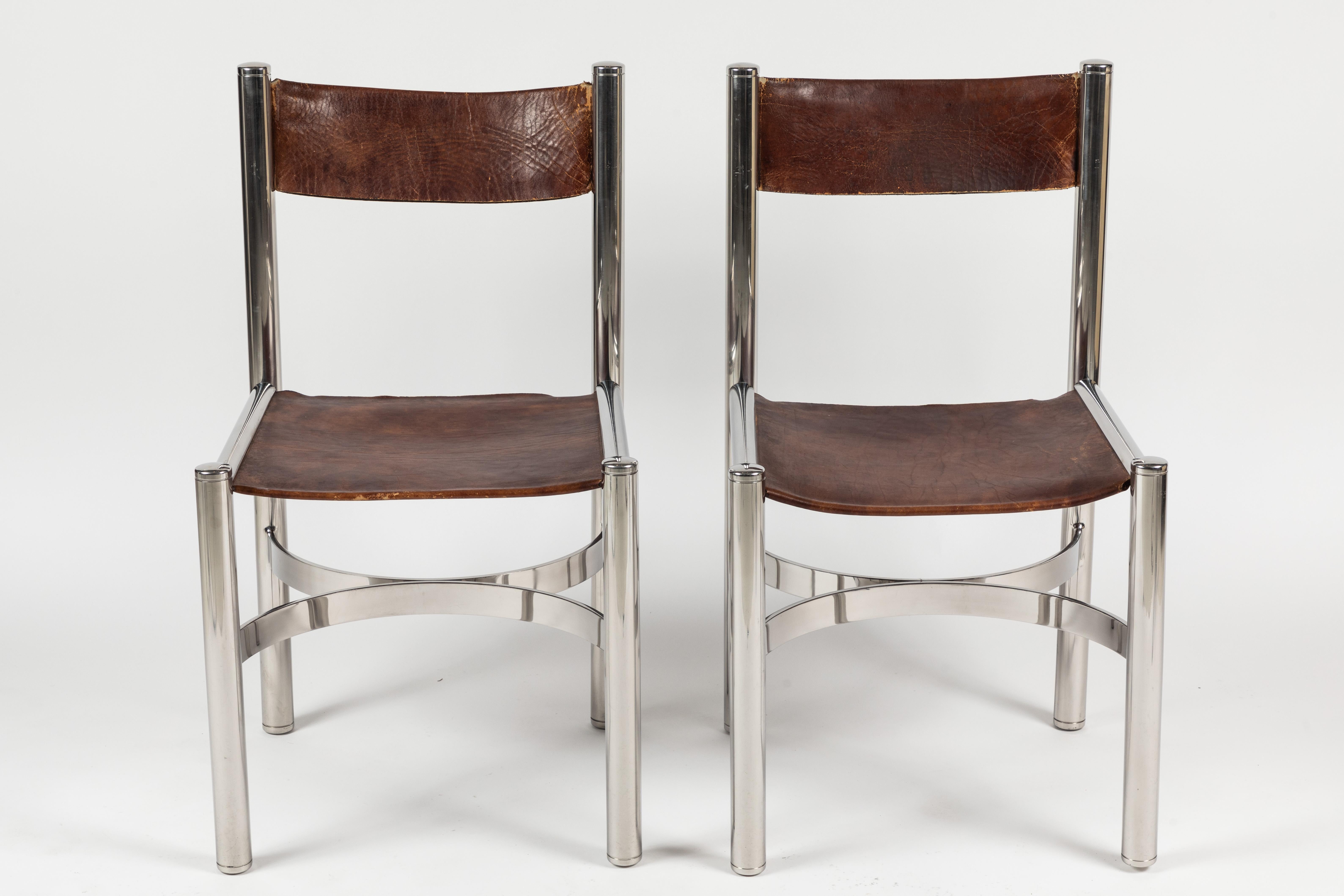 A Fine set of 10 dining chairs, made in Italy by Dada International Design. Chairs have polished chrome frames that support sling style seats and backs. Each chair is stamped with the maker mark, I have found very little about this company only that