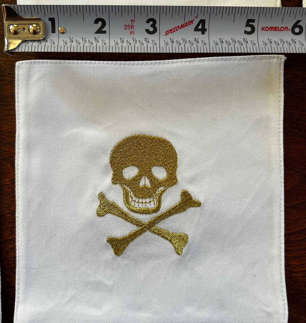 Embroidered Set of 10 Cotton Cocktail Napkins with Gold Skull and Crossbone Embroidery For Sale