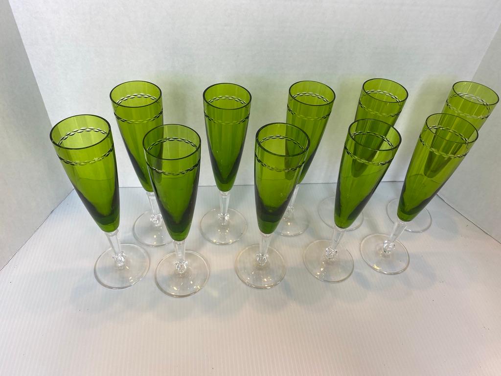 Set of 10 crytsal Nachtham flutes.
Lime green leaded crystal having a etched design to the top rim.