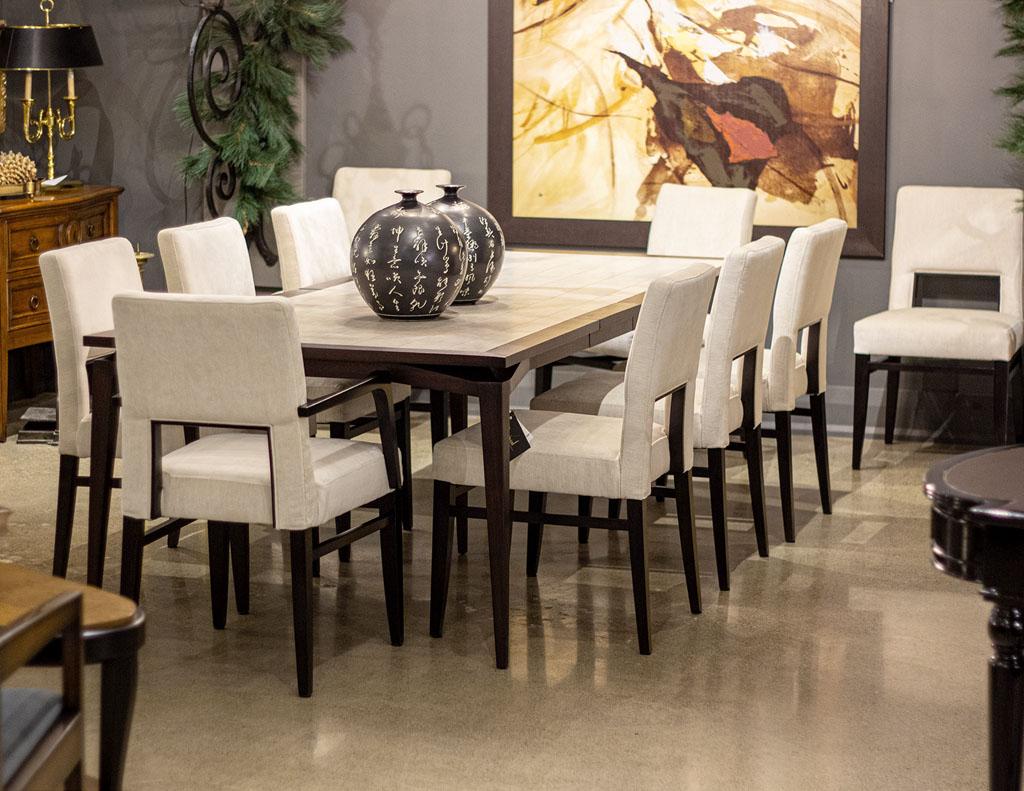 Set of 10 Carrocel custom Finito Modern dining chairs. These beautiful chairs are made in Italy. Featuring unique styling with thick back and seat cushions for added comfort. Its fully upholstered design creates a warmth and softness to the dining